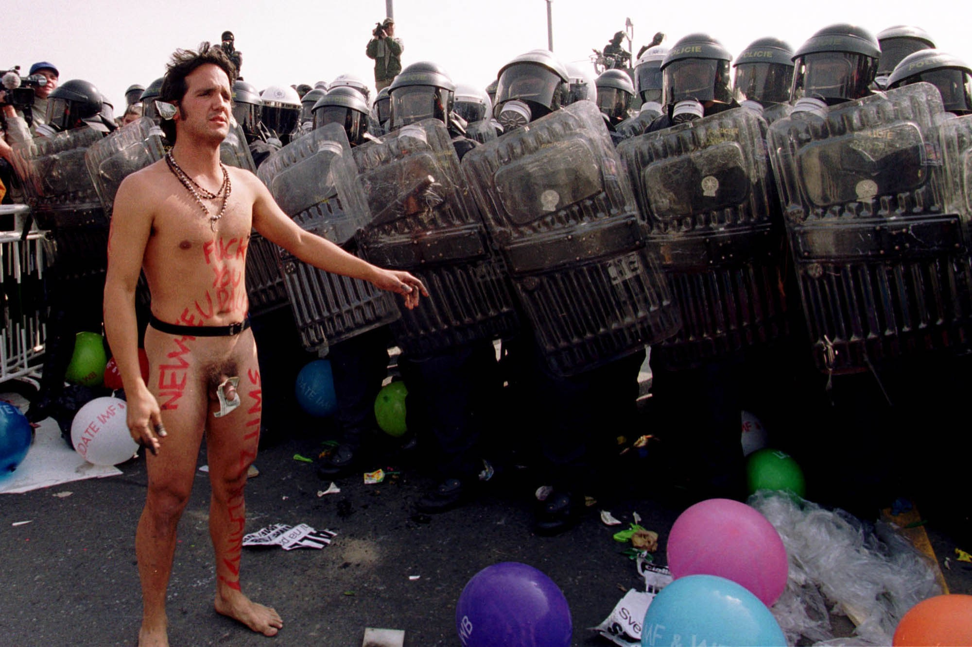 An anti IMF/World Bank protestor faces off on Nusle Bridge leading to the Congress Center in Prague on September 27, 2000. The annual meeting of the World Bank and IMF ended early amid confusion after anti-globalisation protesters brought Prague to a standstill.