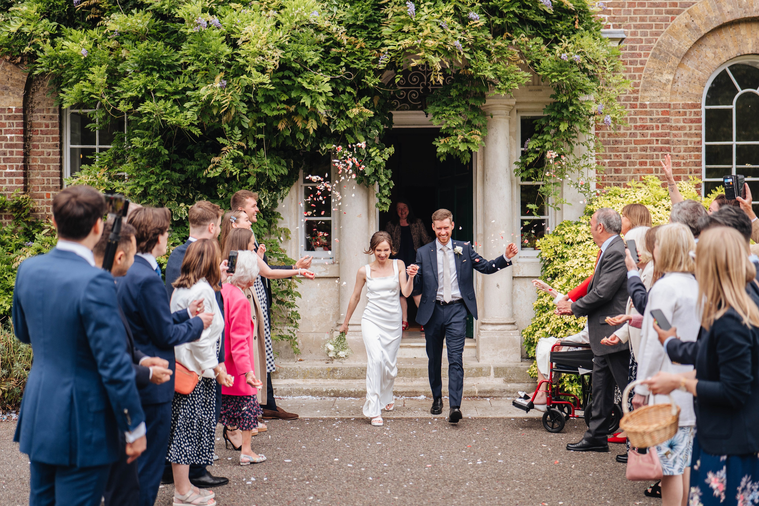 bride and groom happy to see confetti after the ceremony 