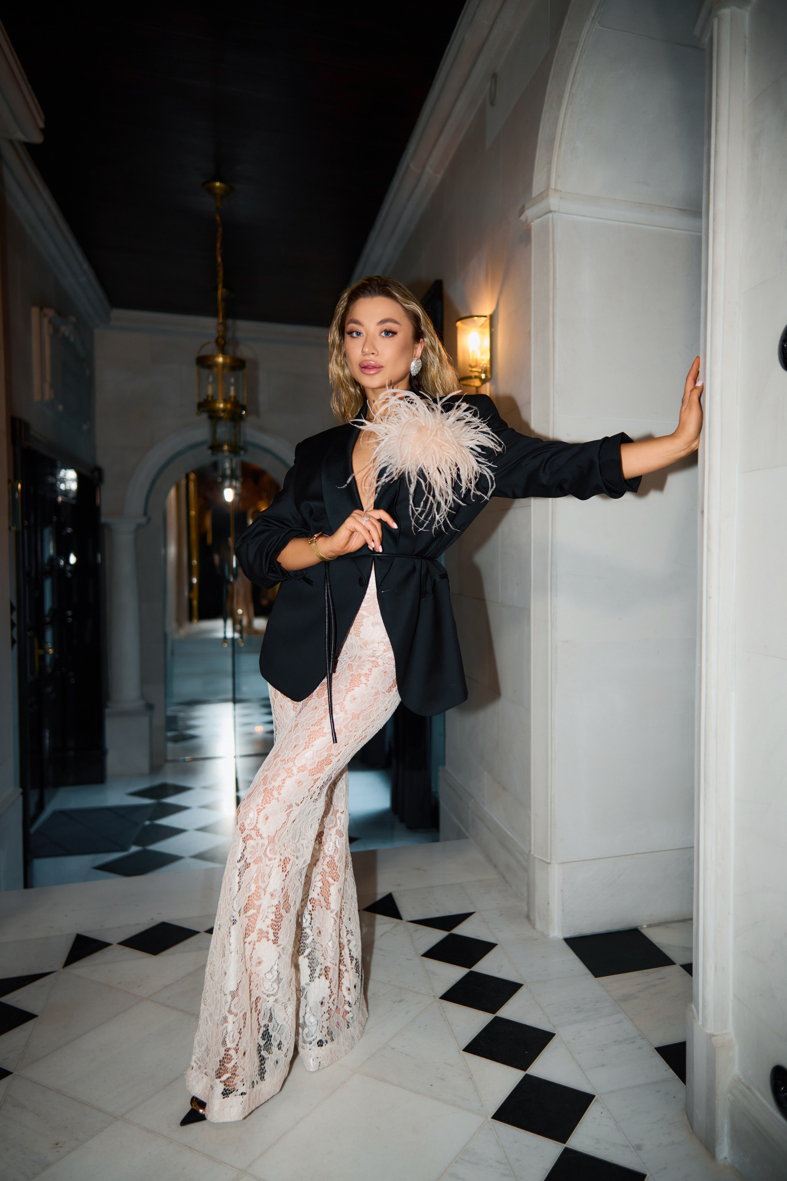 Artistic portrait of woman in upscale estate with ornate architectural details