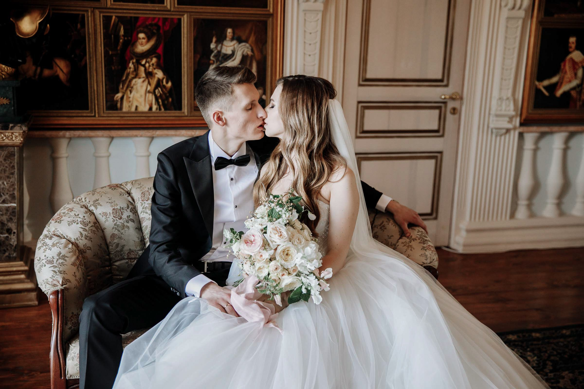 Bride and groom grand room portrait kiss, by Tanya Bodgan, Bude wedding photographer.