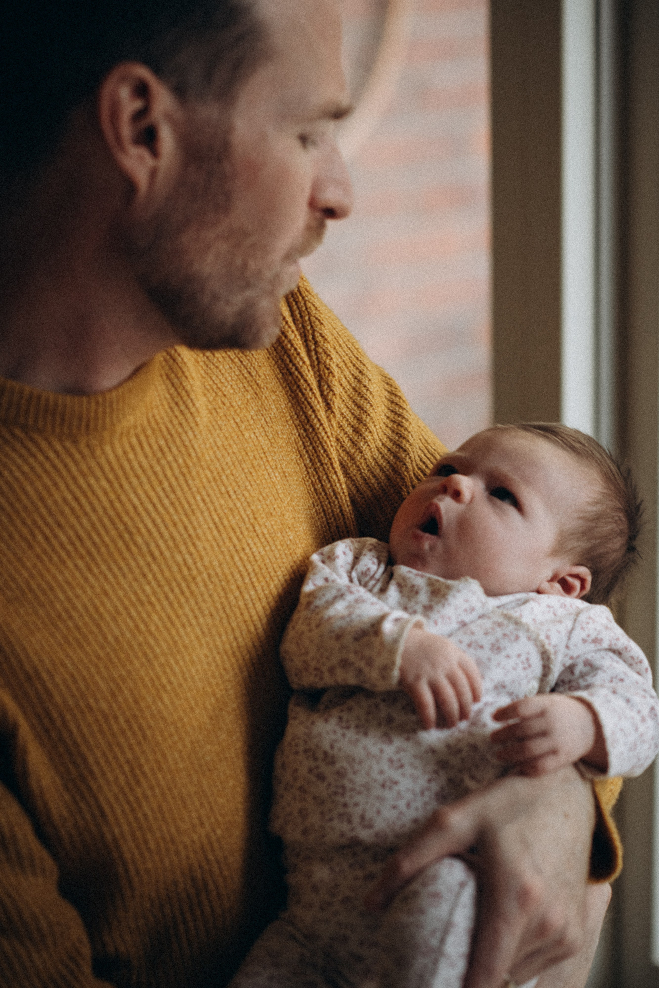 dad holds his baby