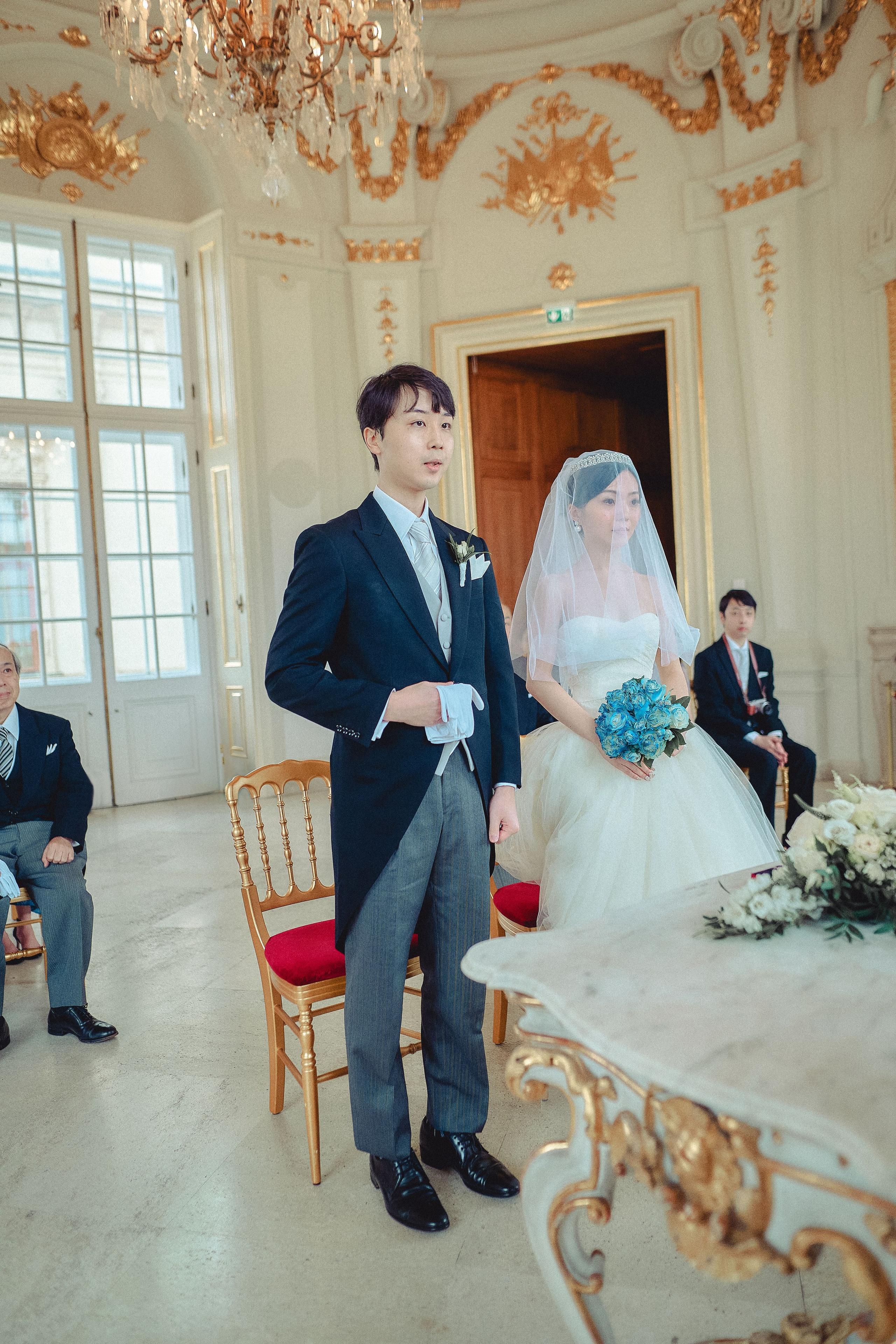 The bride and groom as they stand in the middle of the opulent and historic Octagon during their wedding.