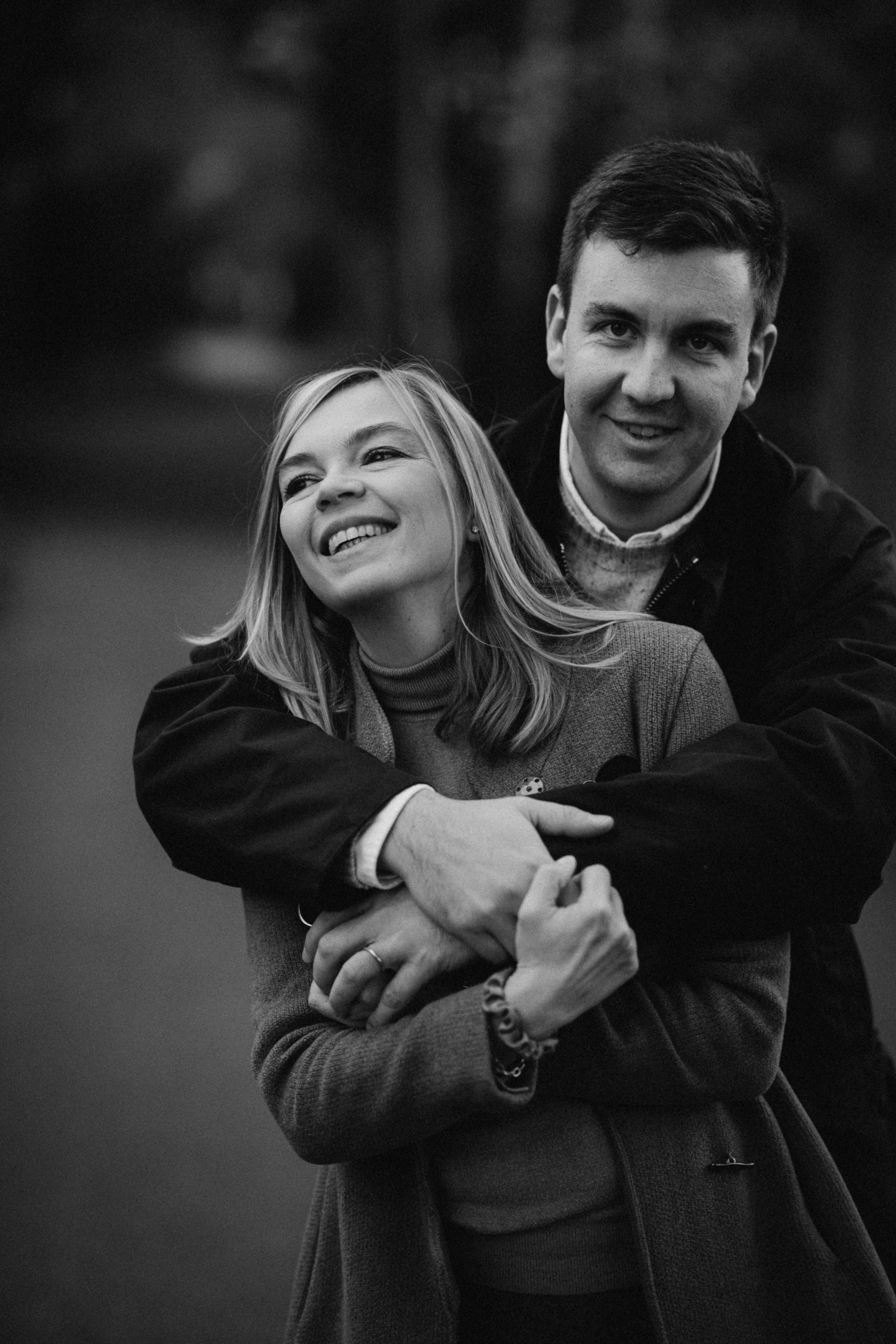 black and white portrait of smiling couple in the park