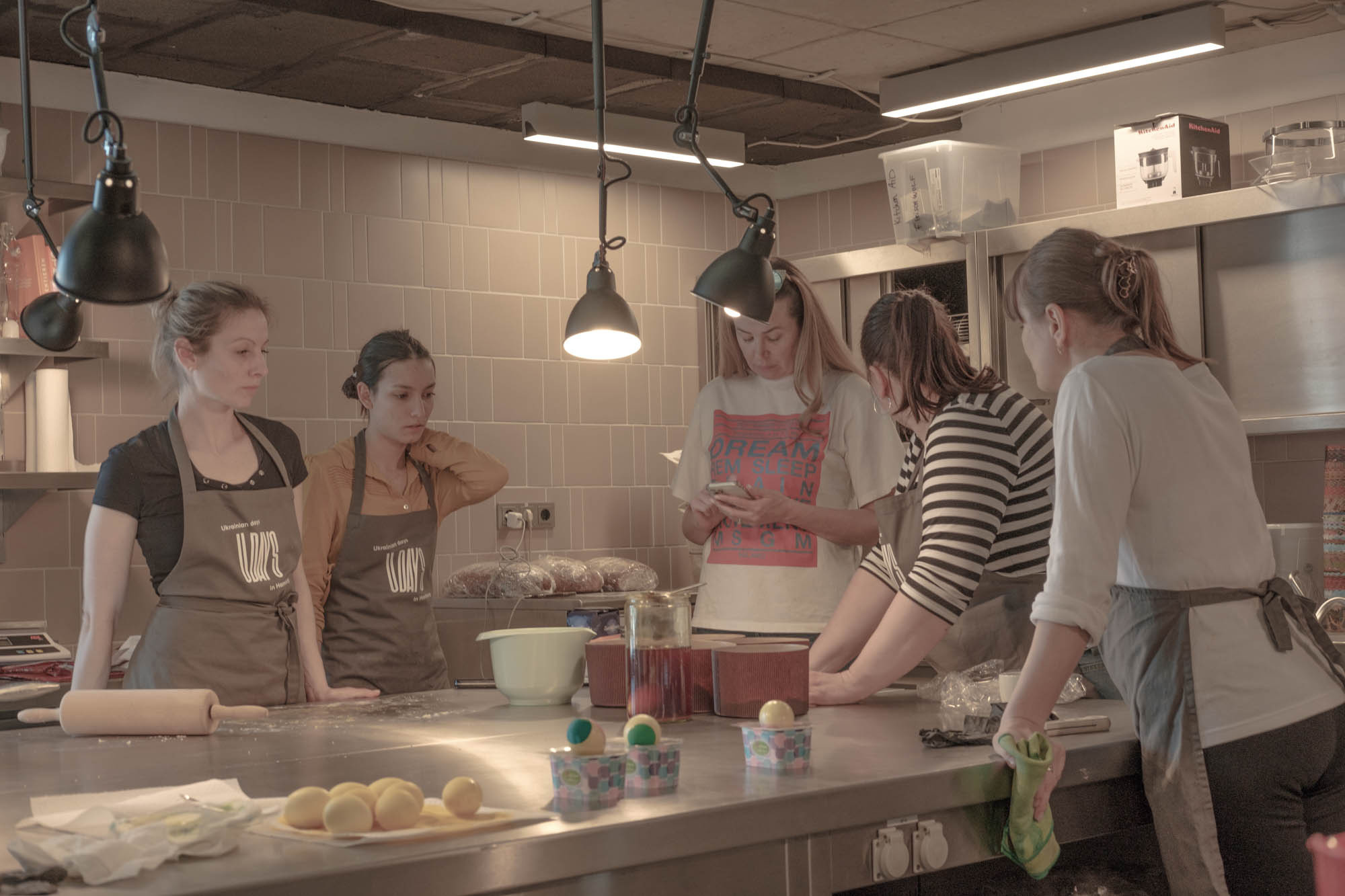 Lilia and Olga are cooking as a volunteer for a week of Ukrainian cuisine in a restaurant in Hamburg. All money they earn during the day will be sent to support the Ukrainian army, April, 2022