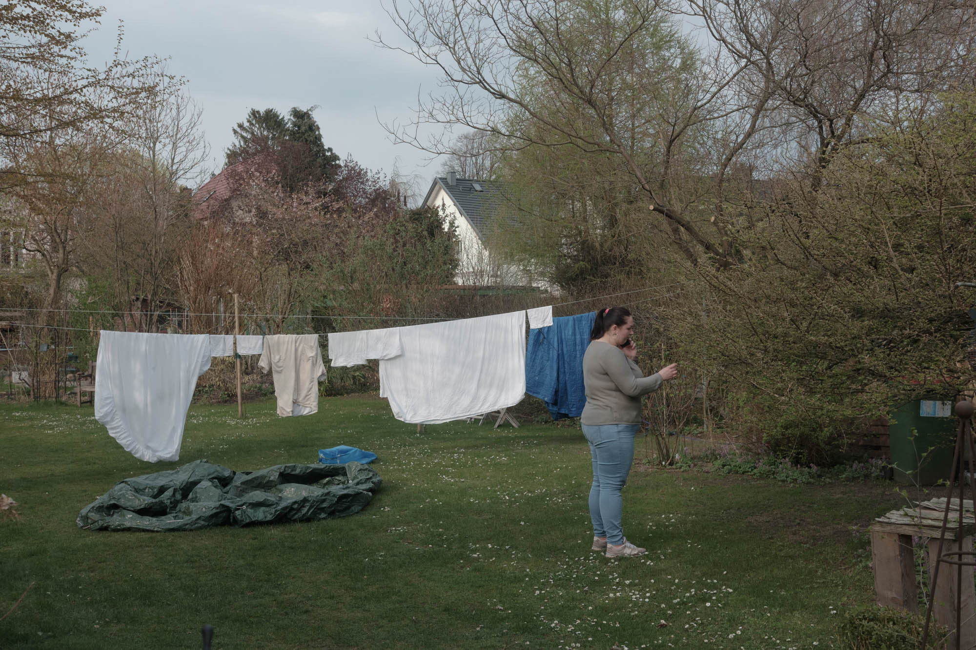 Lilia is talking by phone in the garden in Julia's and Max's house. In March Julia and Max hosted three people in their house: Boris, Olga, their daughter Sabrina, the dog Richard. Later arrived their acquaintance from Kiev Svetlana. Then another acquaintance Liliya and the Olga's father Vitaly. Liliya and Vitaly were hosted by the Julia's and Max's neighbors on the street. 