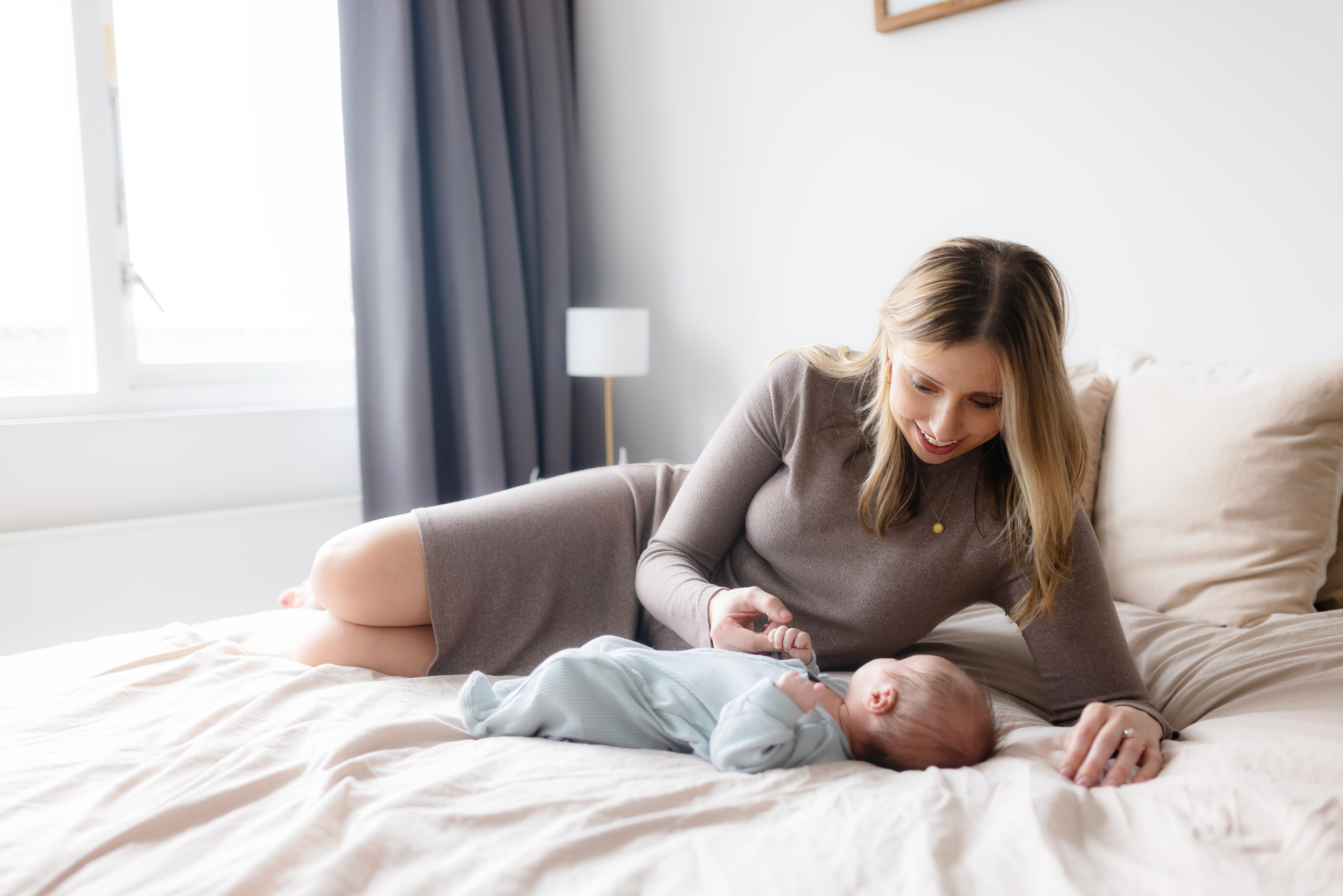 A mother gazes lovingly at her baby.