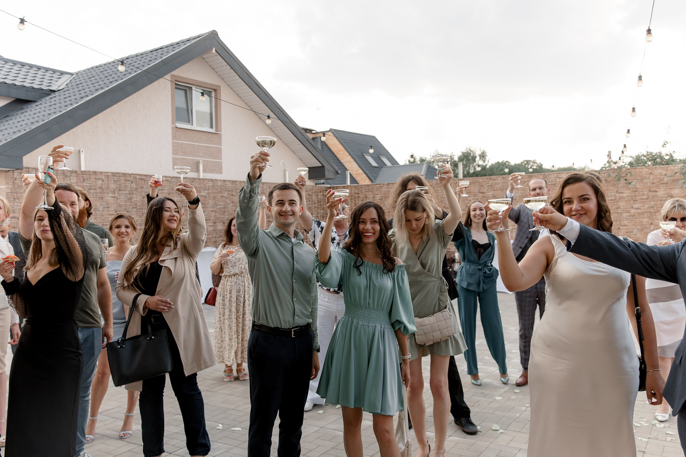 Guests at riverside reception, by Tanya Bodgan, Bude, Cornwall wedding photographer.