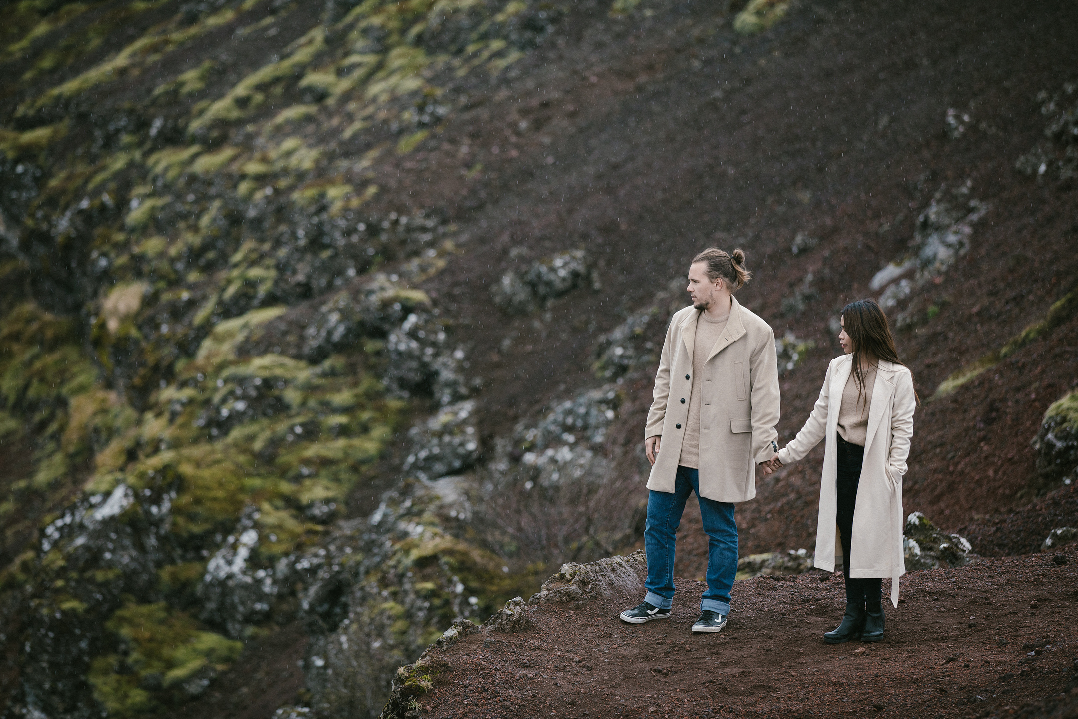 Iceland engagement photography at scenic crater edge