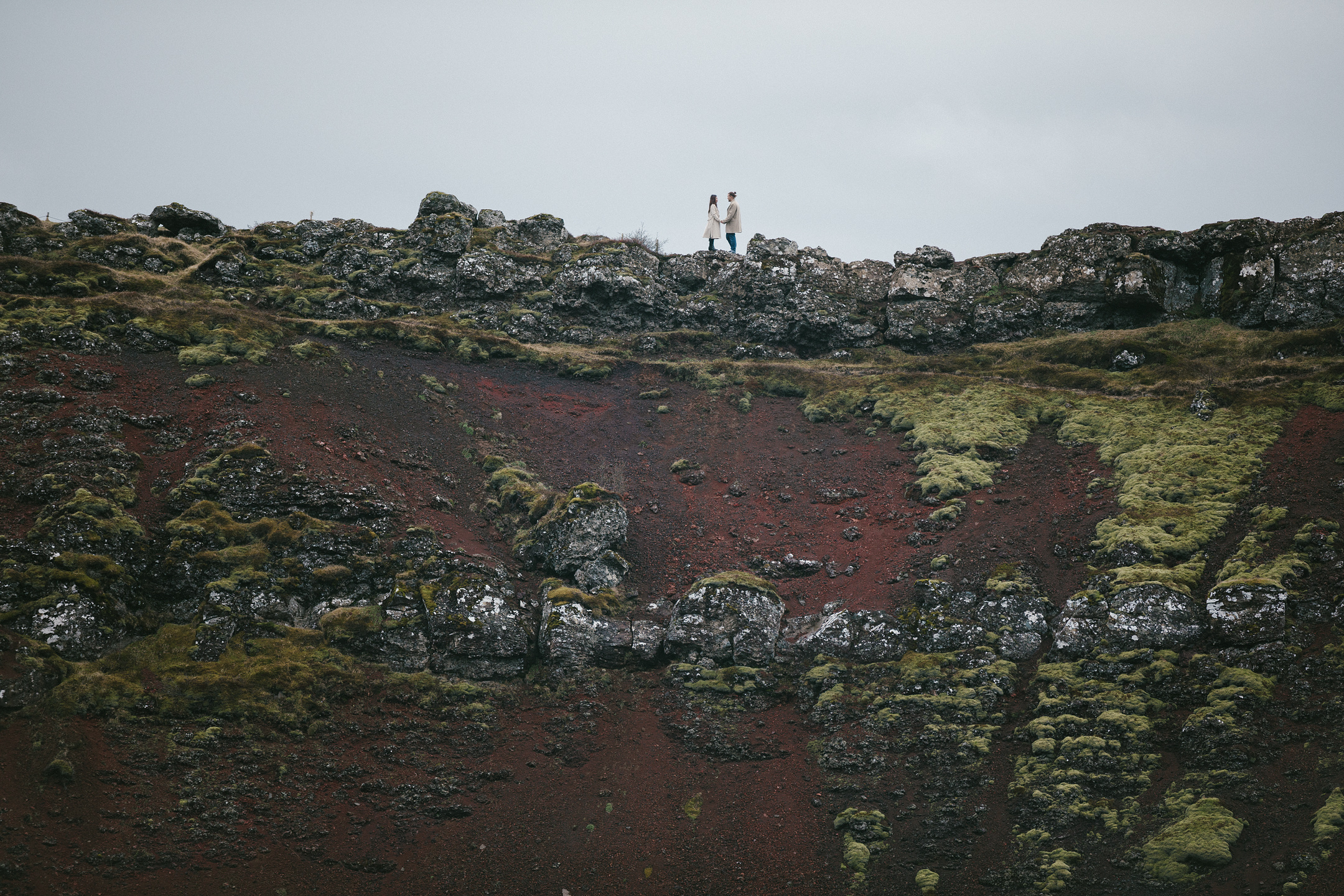 Wedding photography on mossy cliff at Kerid crater