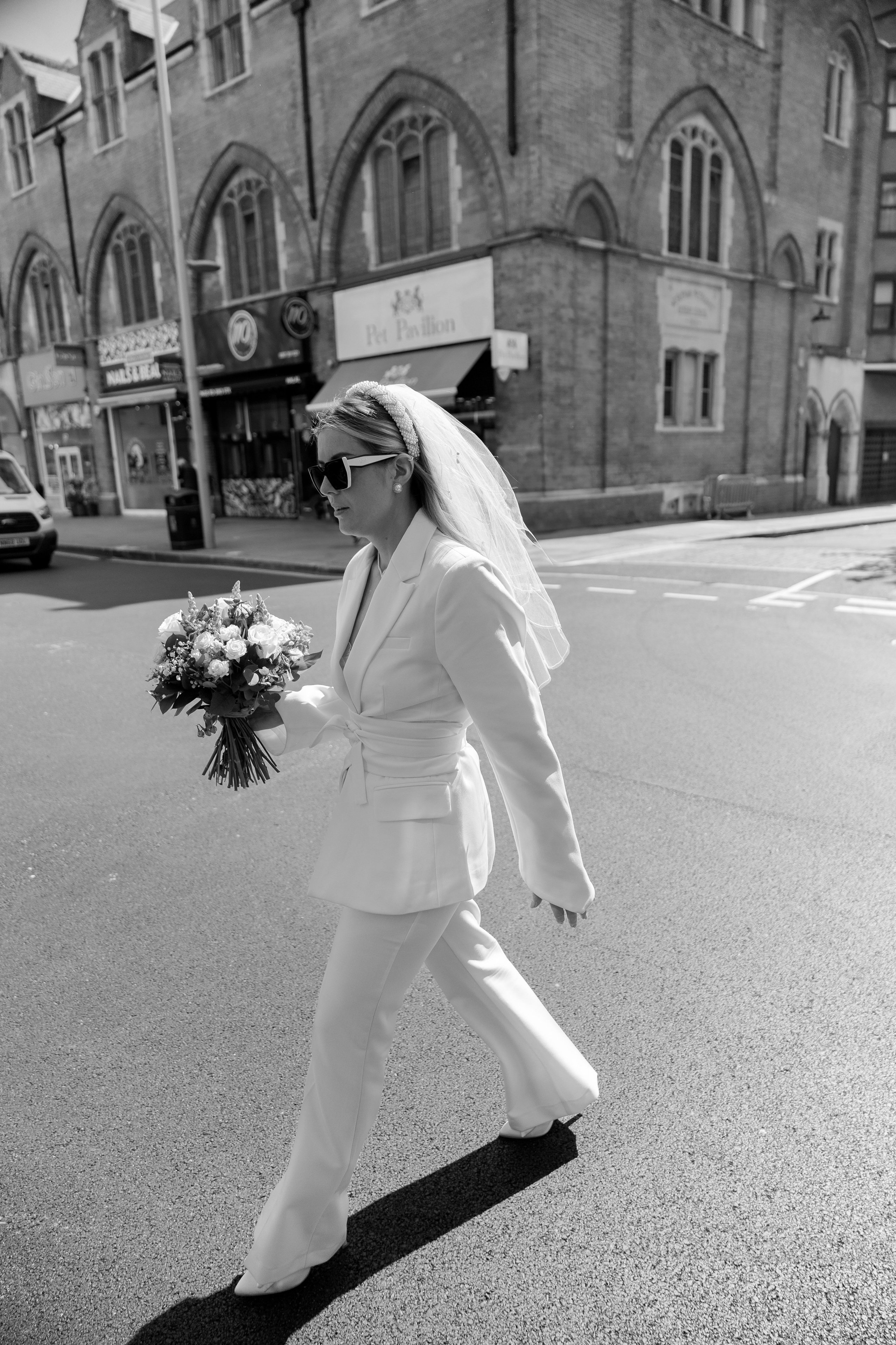 Elegant wedding portrait of bride and groom walking through the streets of ParisRomantic elopement moment captured in soft evening light in Paris, FranceLuxury wedding ceremony setup in a historic French venue with natural floralsCandid black and white photo of a couple at their city wedding in London, UKTimeless couple portrait in front of Marylebone Town Hall, LondonEditorial-style bridal preparation in a classic townhouse in the heart of LondonSoft light bridal portrait in a countryside château wedding in FranceFine art flat lay with French-inspired wedding details and vintage texturesCinematic golden hour photo at a UK estate wedding with historic architectureLuxury wedding tablescape with candles and florals at a London reception