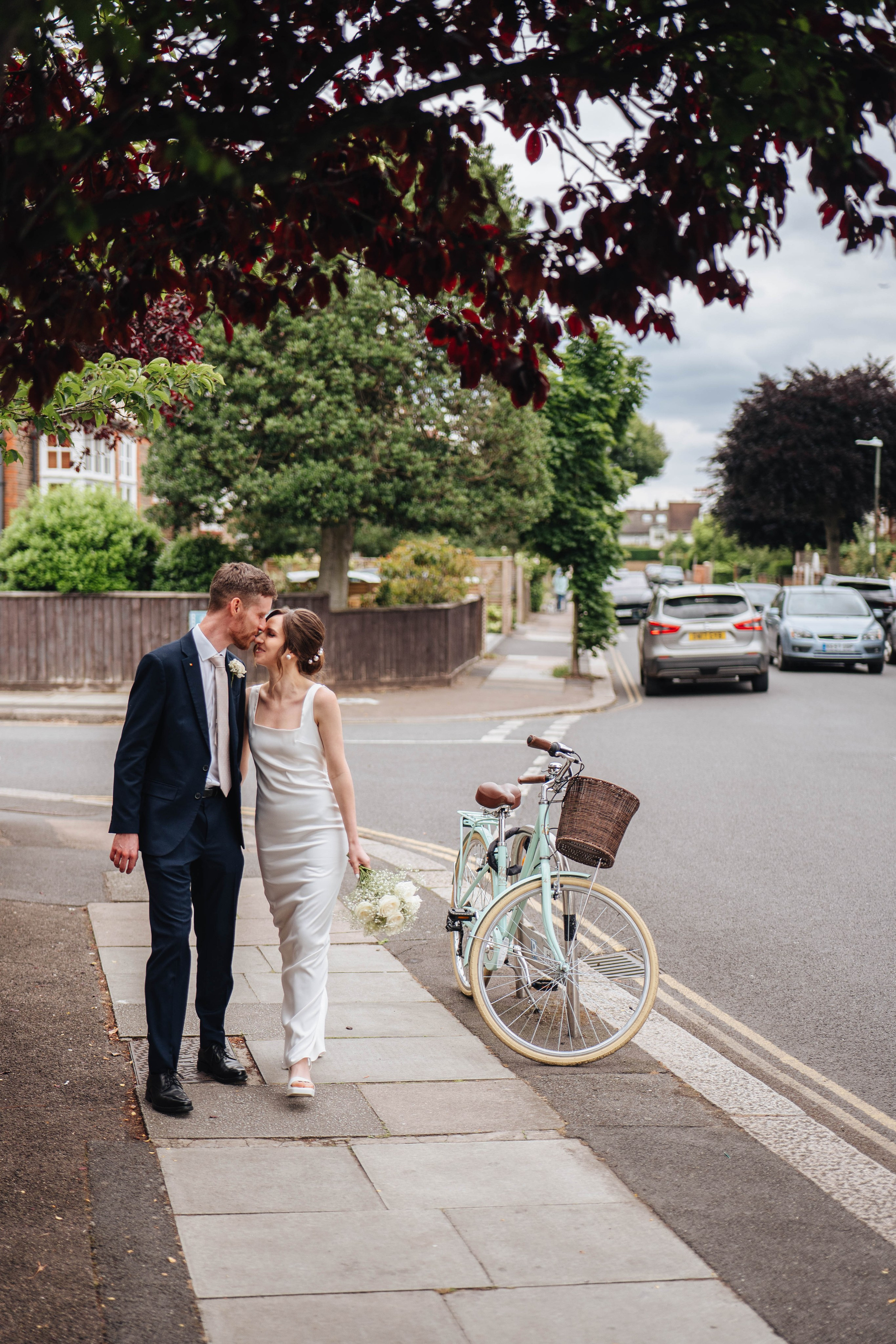 bride and groom from the back walking down the street in London