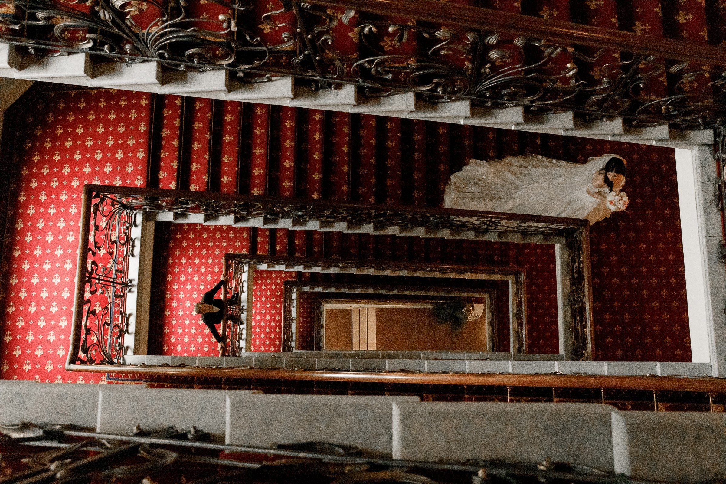 Bride and groom on staircase , by Bude, Cornwall reportage photographer.