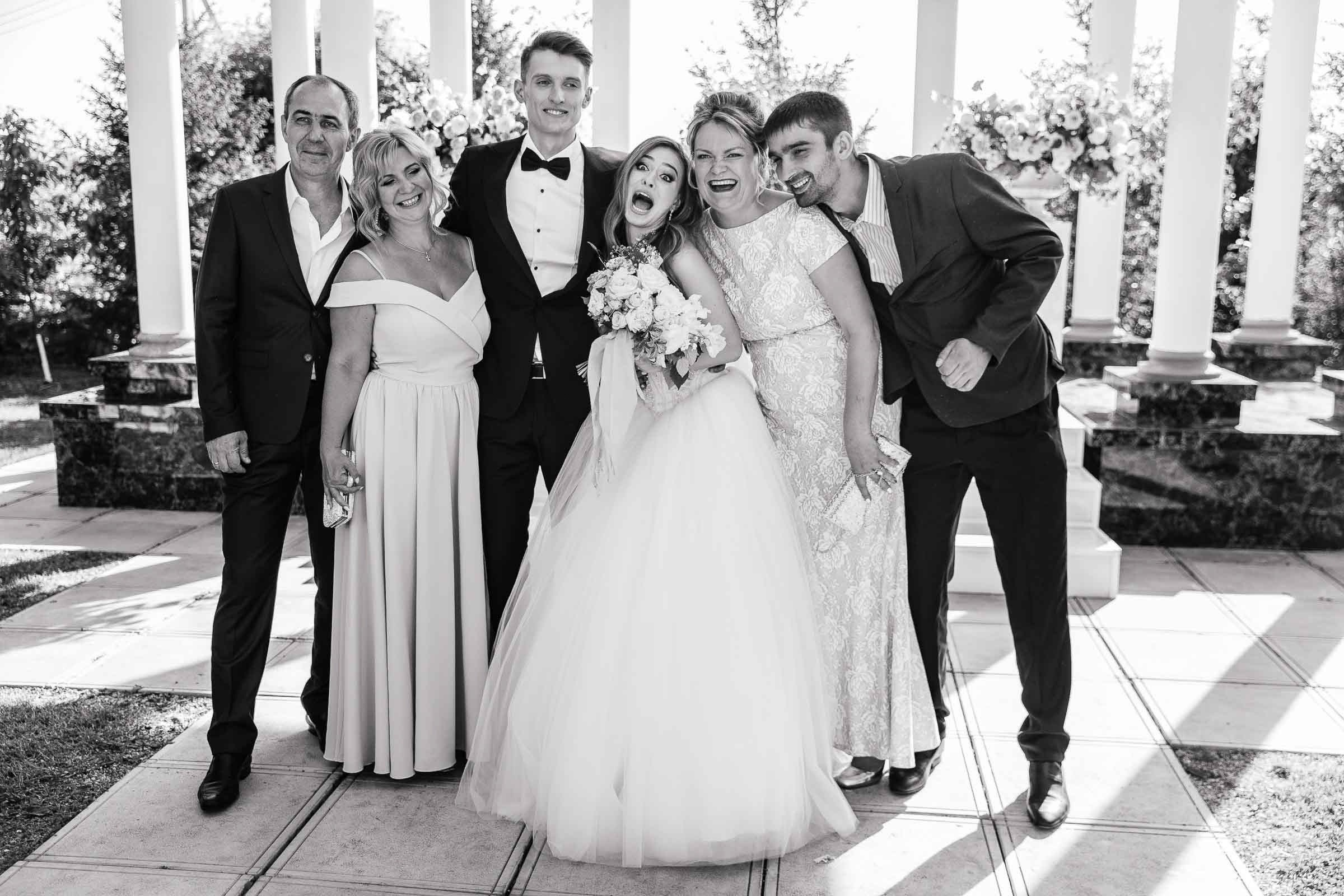 Bride and groom fun family portrait, by Tanya Bodgan, Bude wedding photographer.