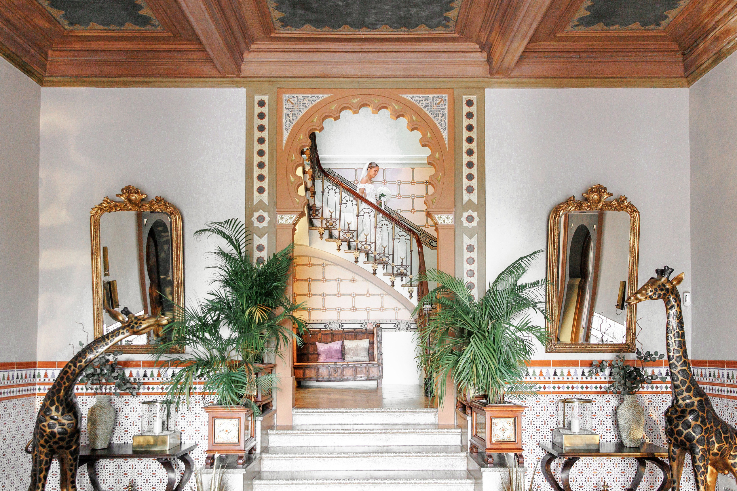 Luxury Spanish wedding venue with ornate staircase and fine art photography