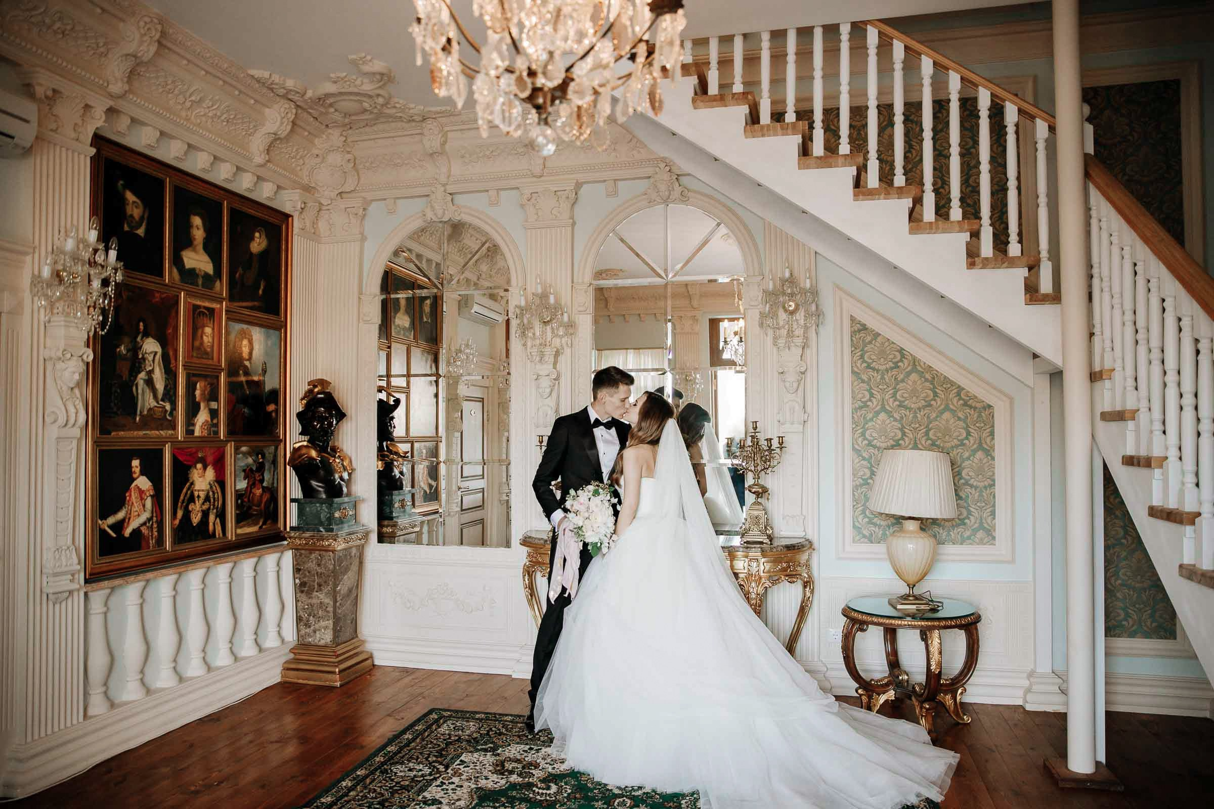Bride and groom grand kiss, by Tanya Bodgan, London wedding photographer.