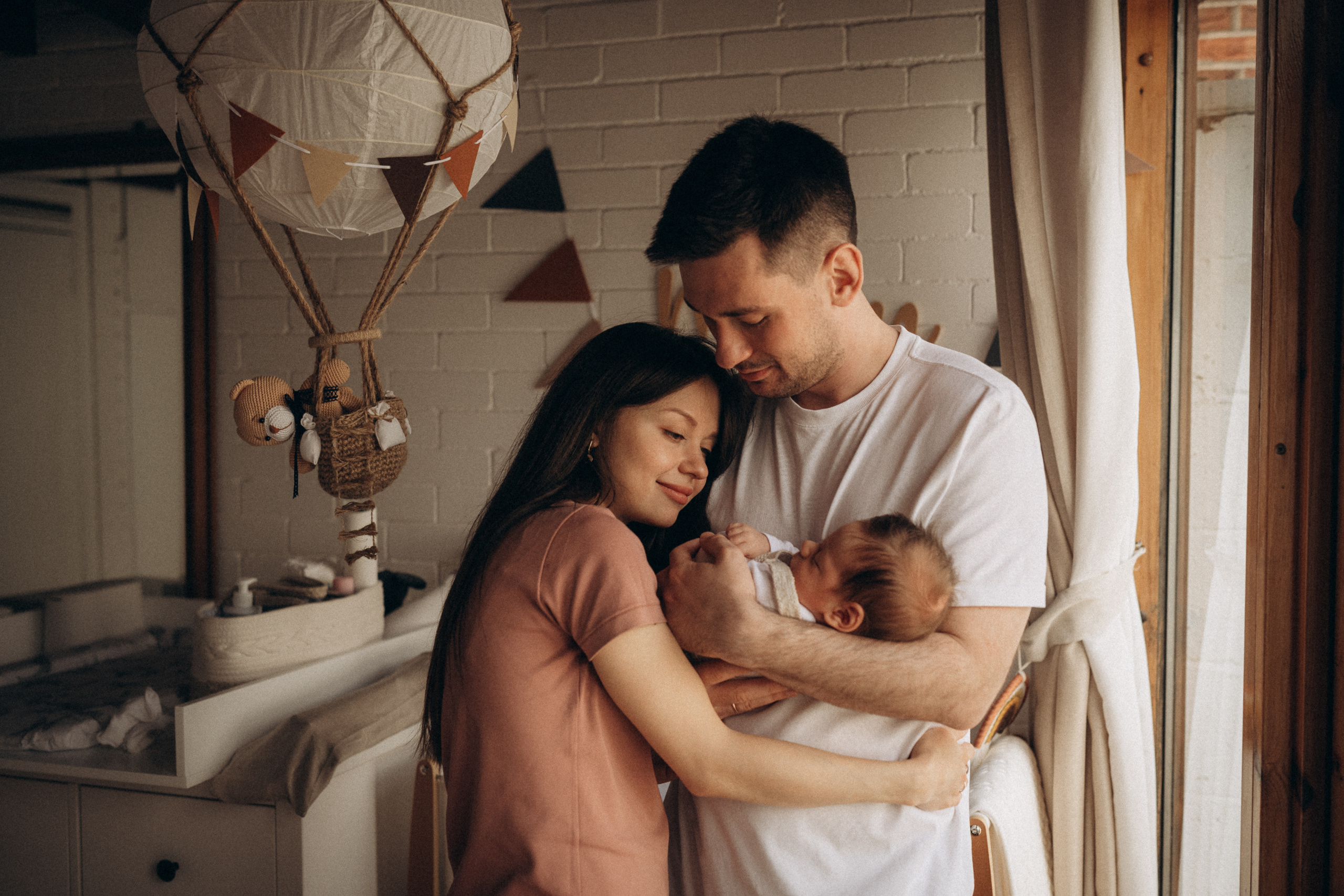 parents hold their baby