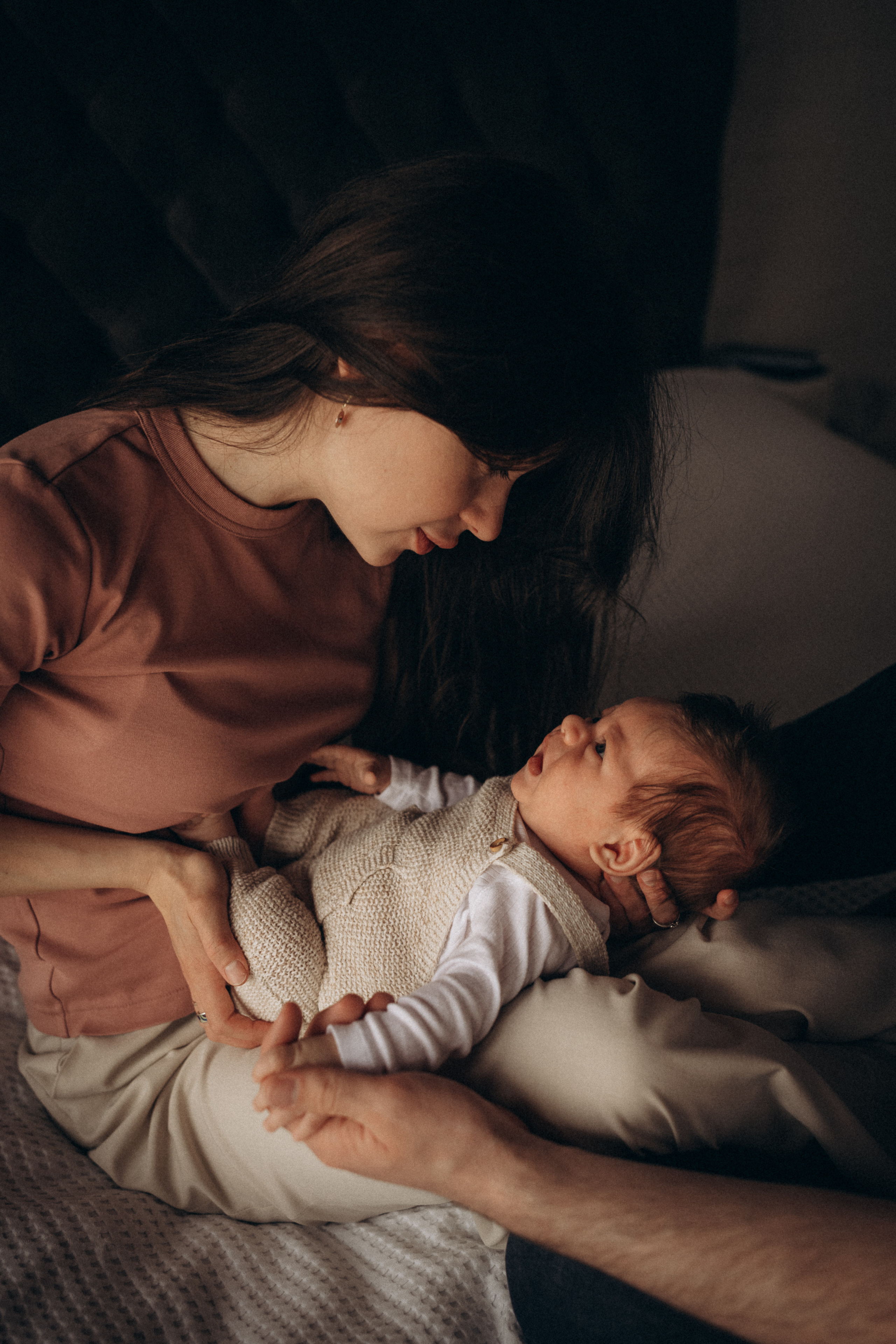 mum looks at her newborn baby boy