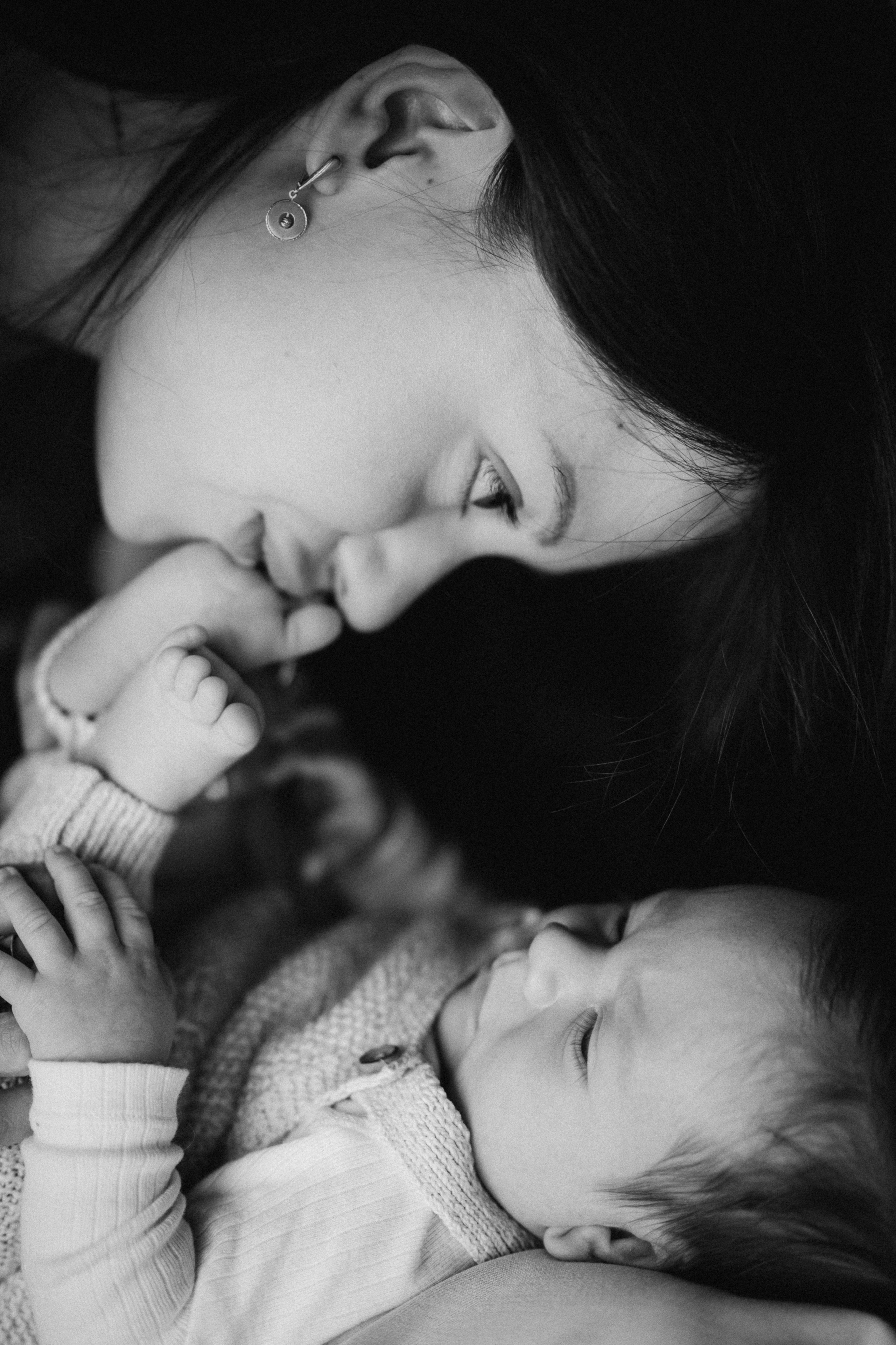 mum kissing her baby feet