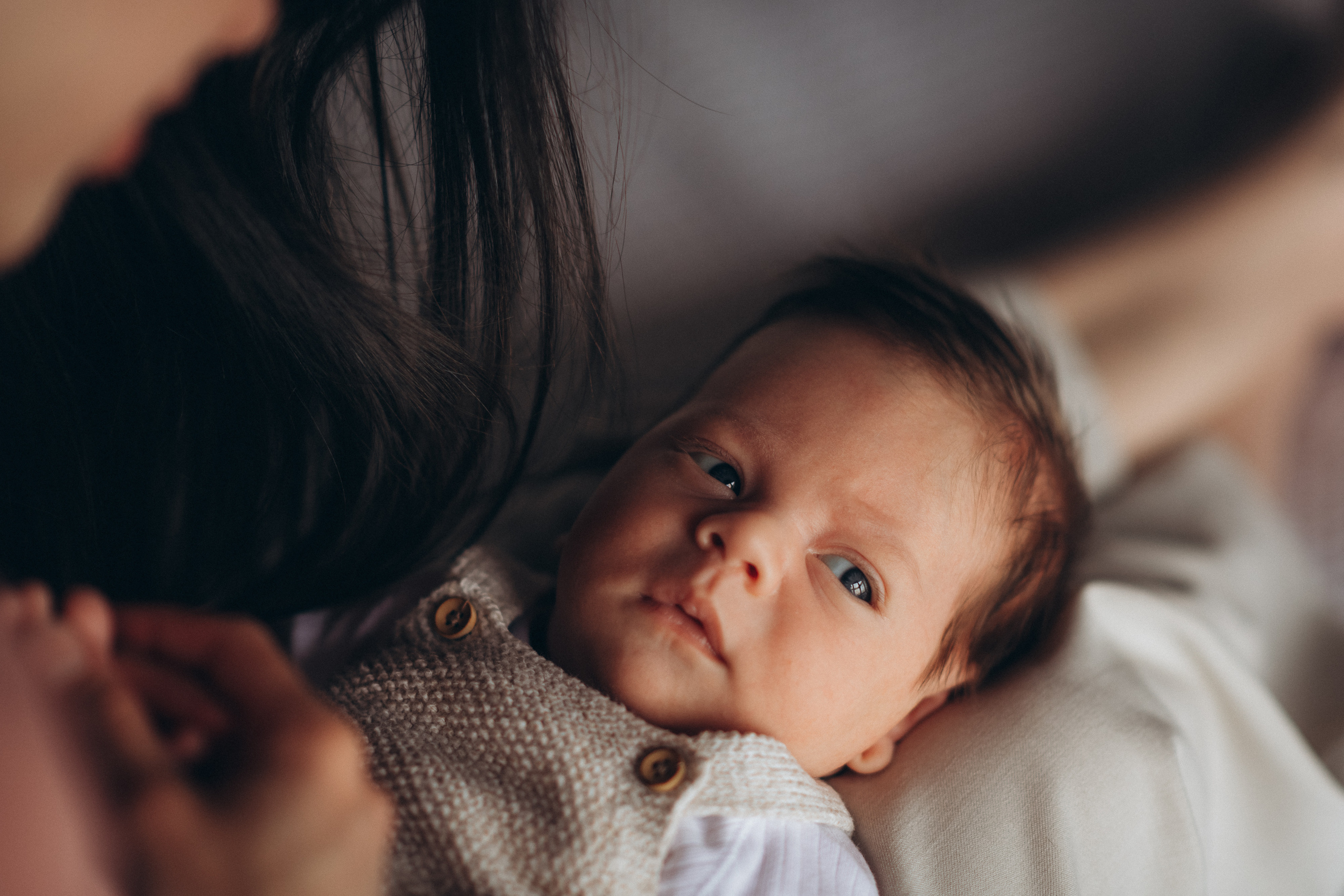 newborn baby boy at home with his parents