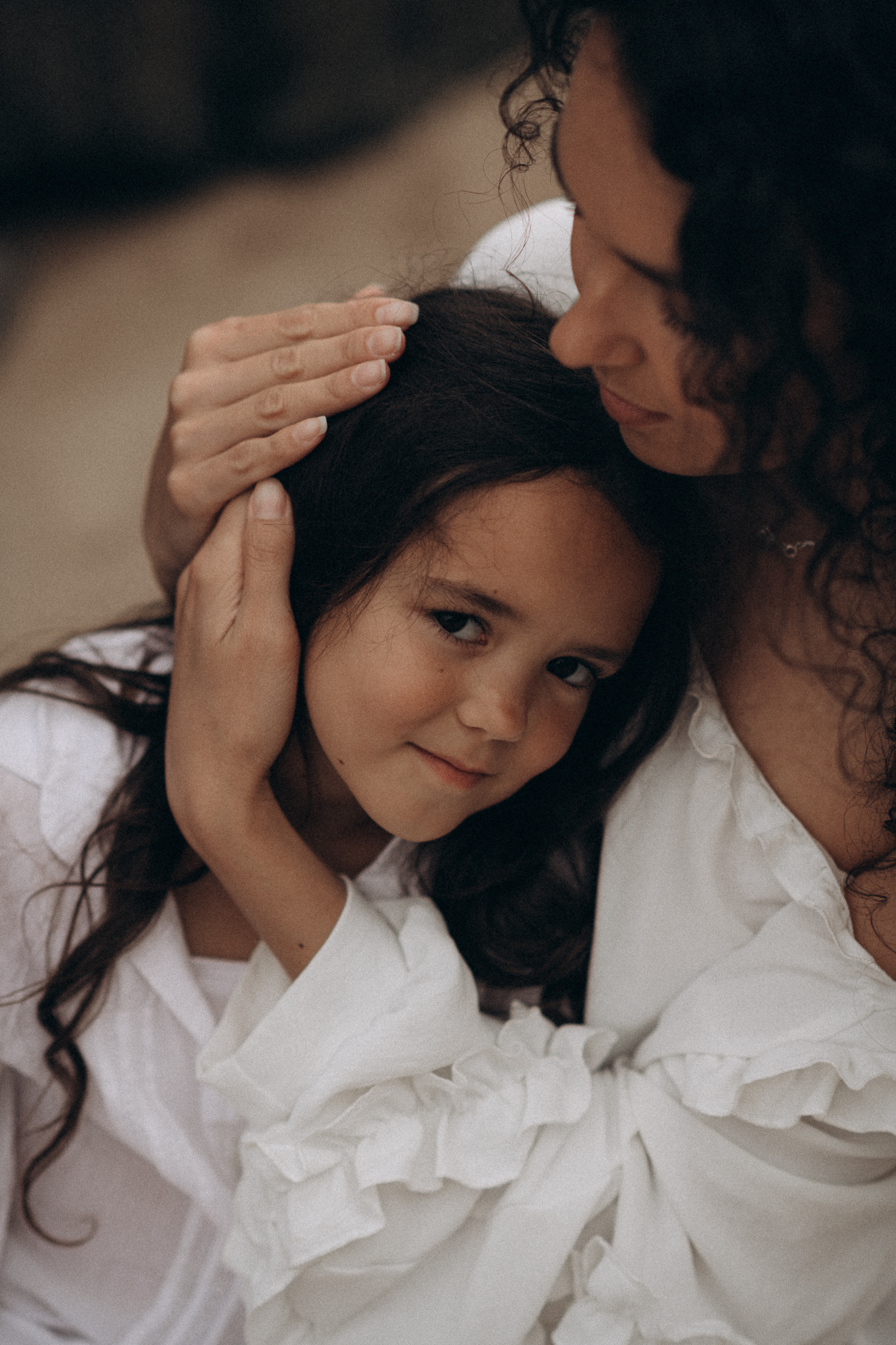 mum with her daughter on the beach