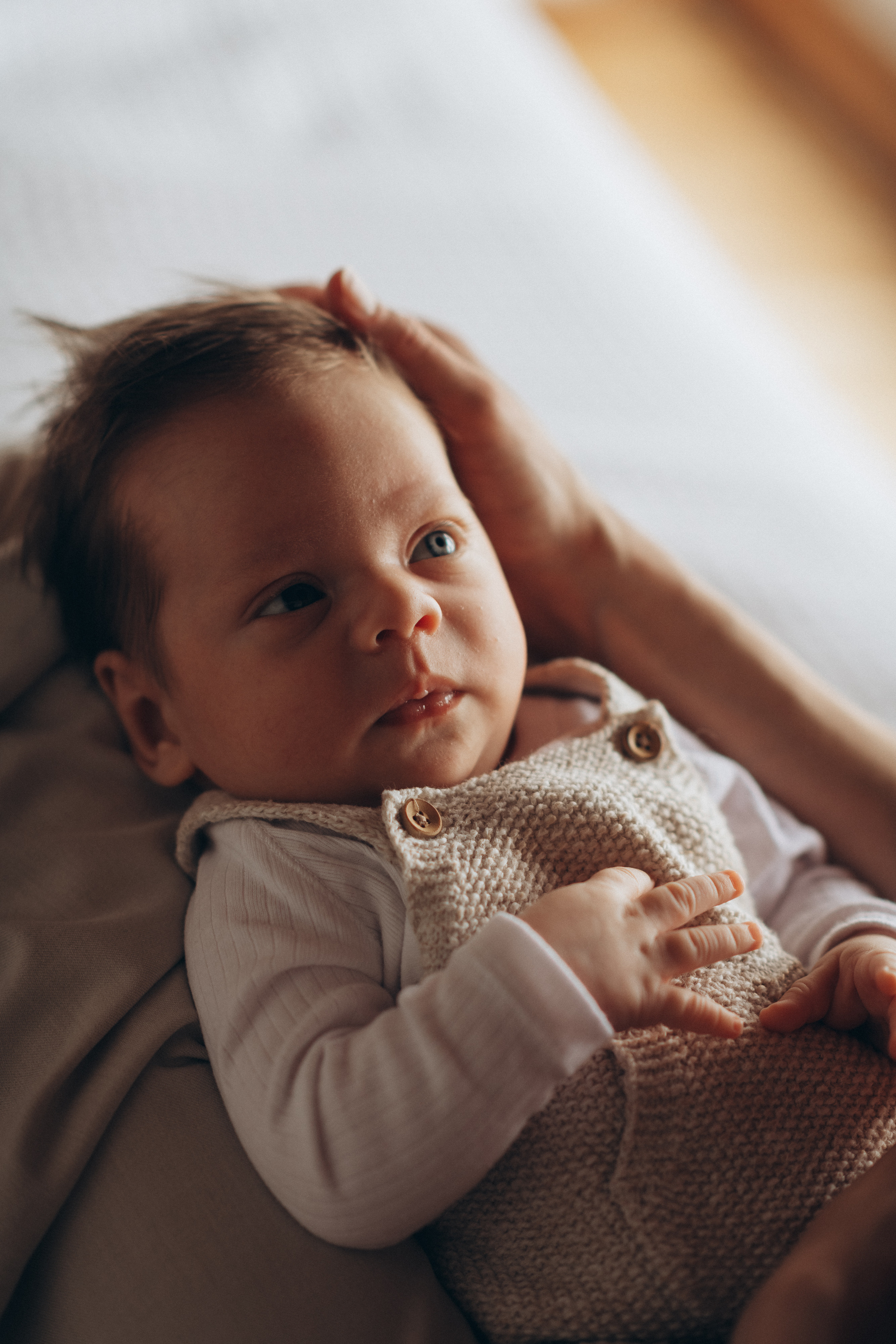 newborn baby boy look at his mother