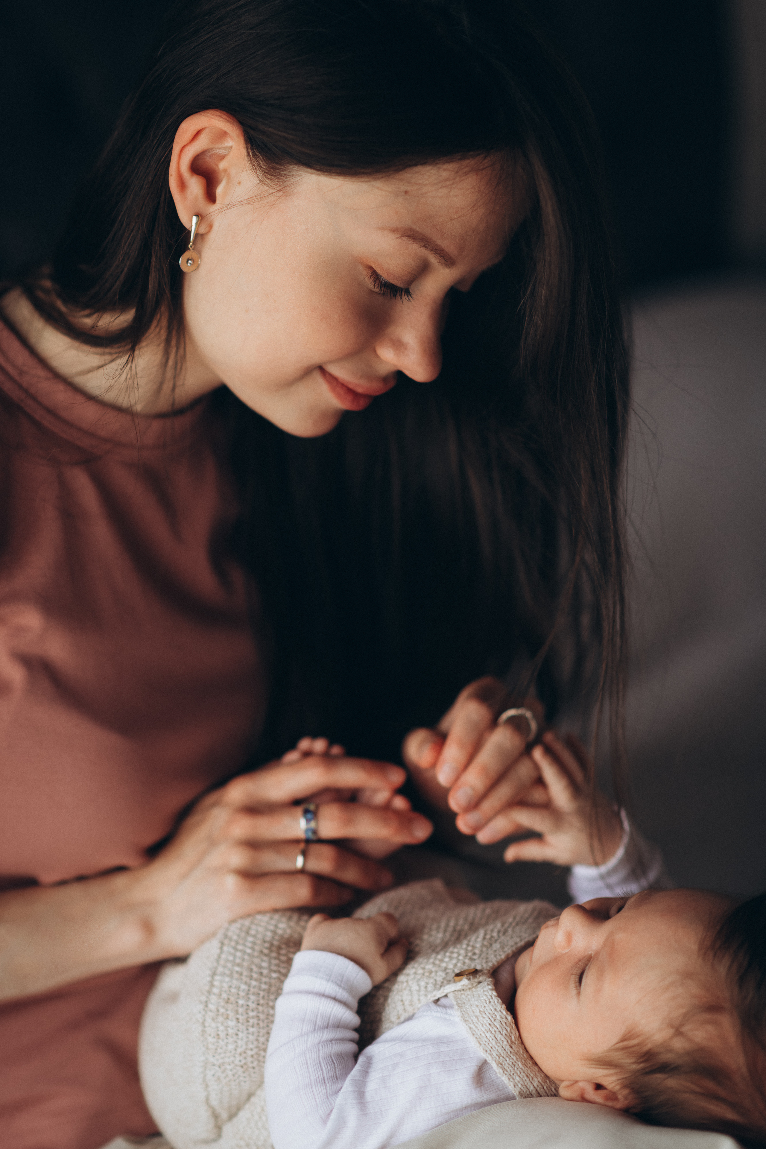 mum holds her baby hands
