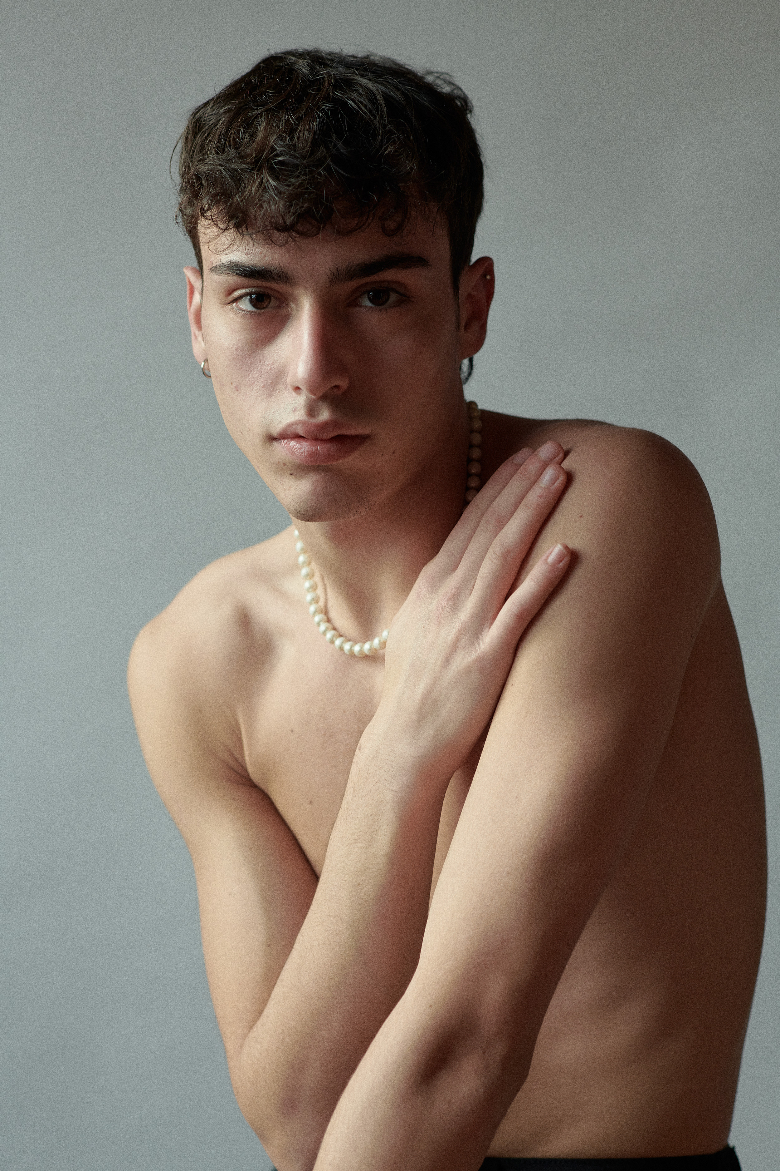 Nude fine art photographer Amsterdam, young man with perl necklace 