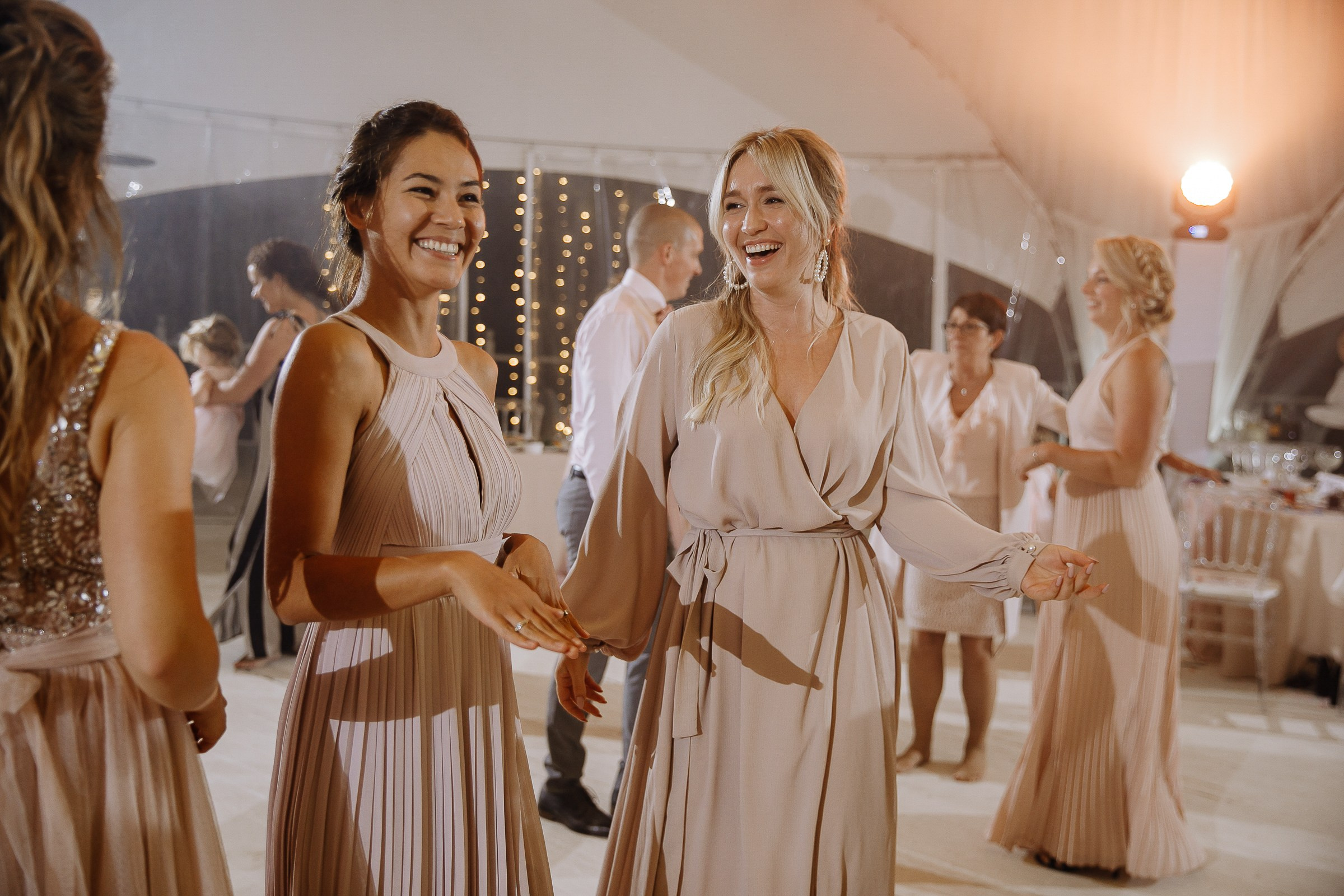 Bridesmaids dancing, by Devon wedding photographer.
