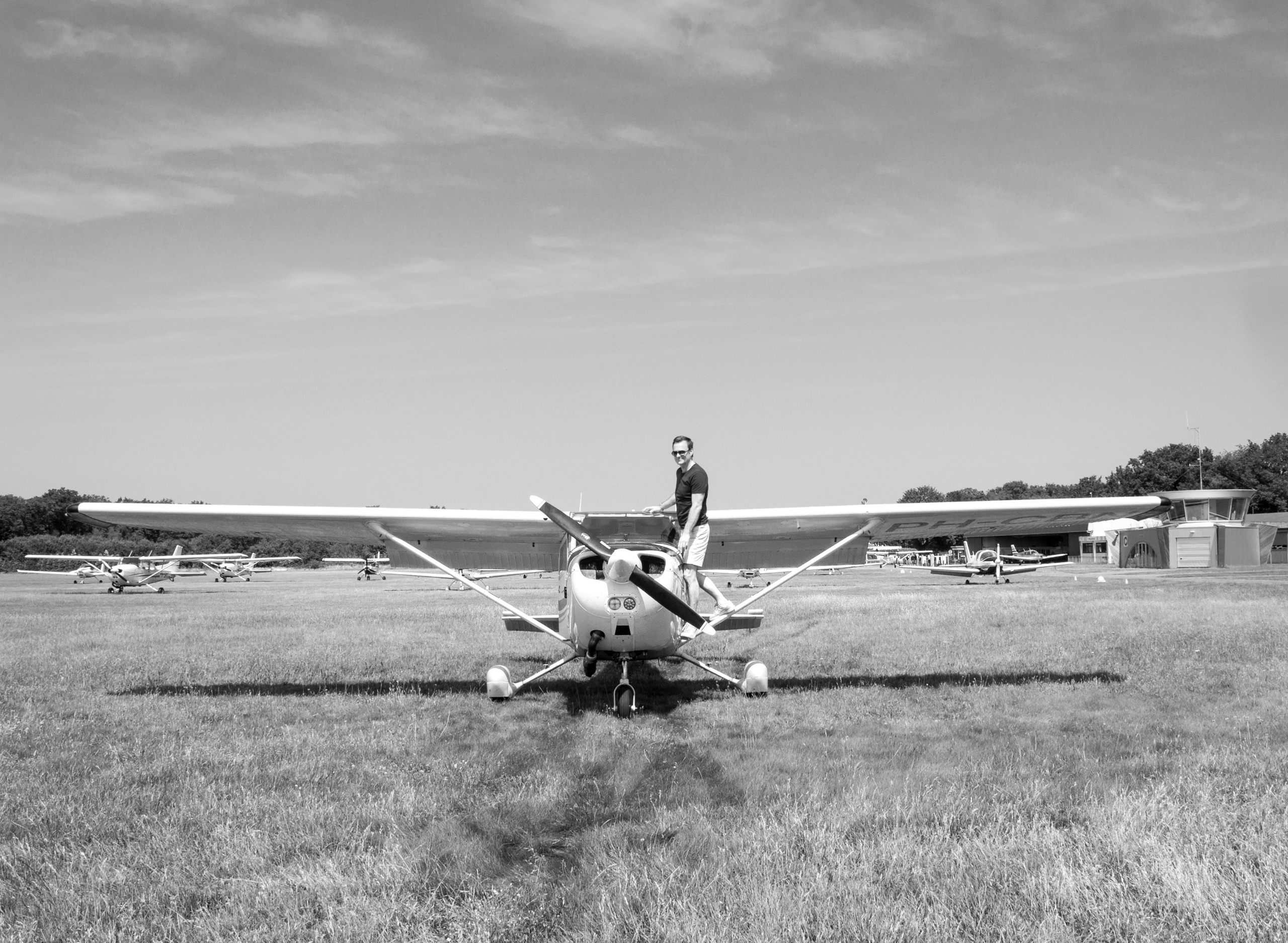 A photoshoot of a pilot and planes. Éclat Photos. Exclusive portrait photography service