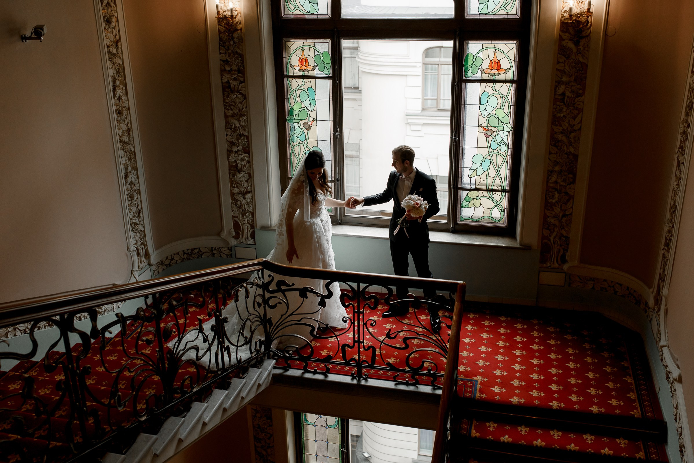 Bride and groom's staircase moment, by Bude, Cornwall reportage photographer.
