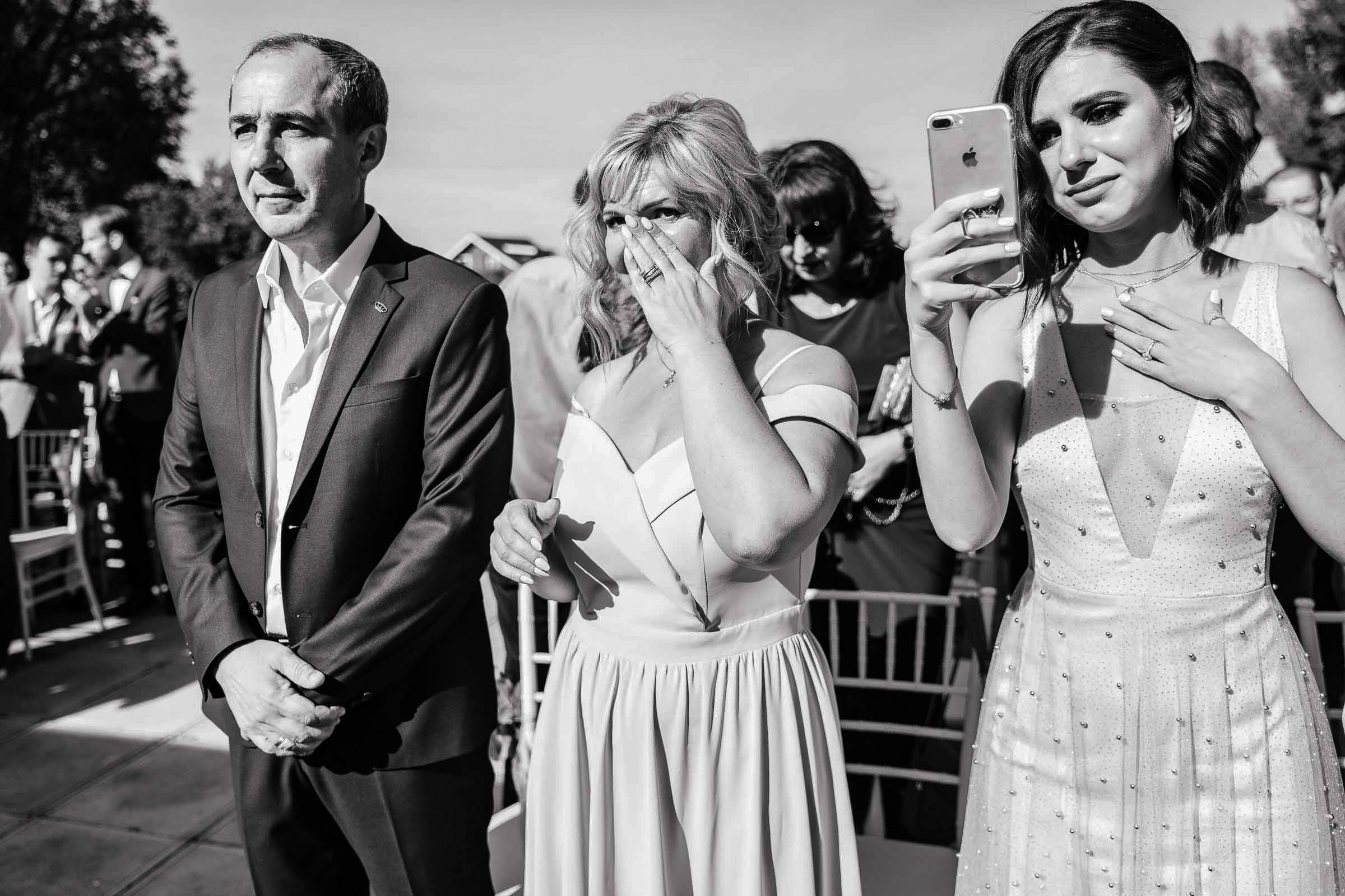 Emotional guests watching ceremony, by Tanya Bodgan, Newquay wedding photography.