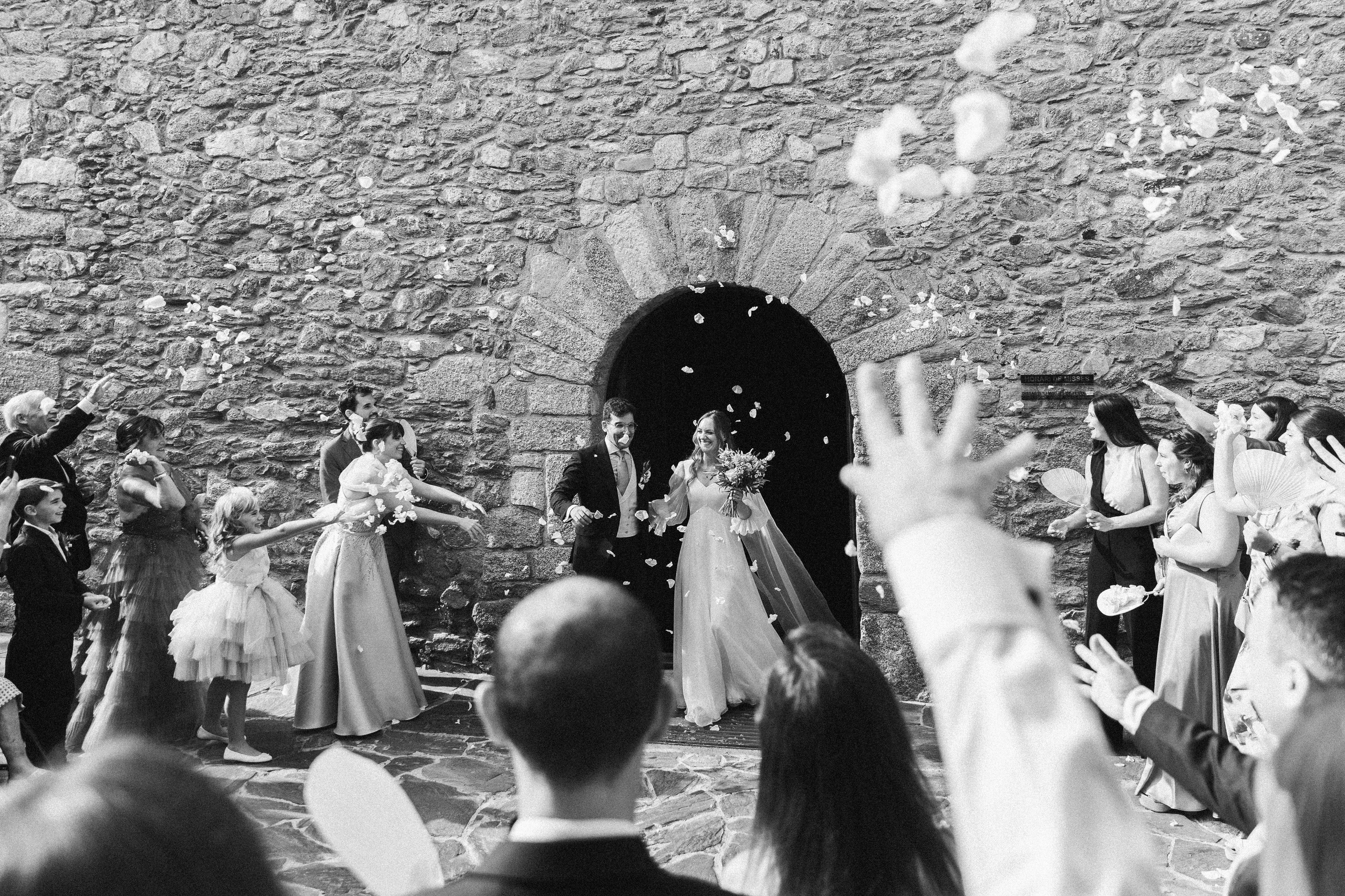 Couple leaving the church after the religious ceremony of the wedding in Barcelona