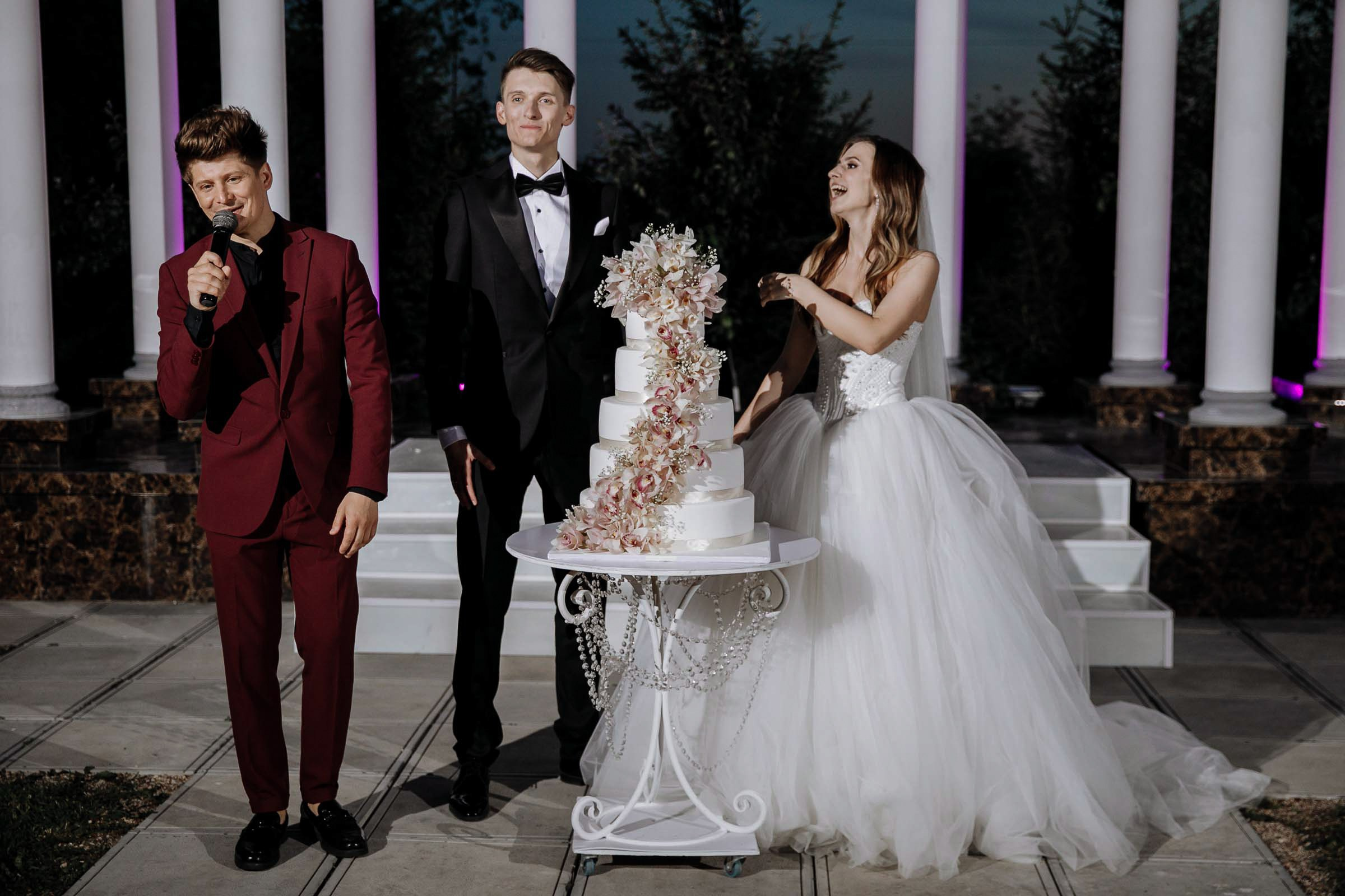 Couple’s cake cut, by Tanya Bodgan, Bude wedding photography.