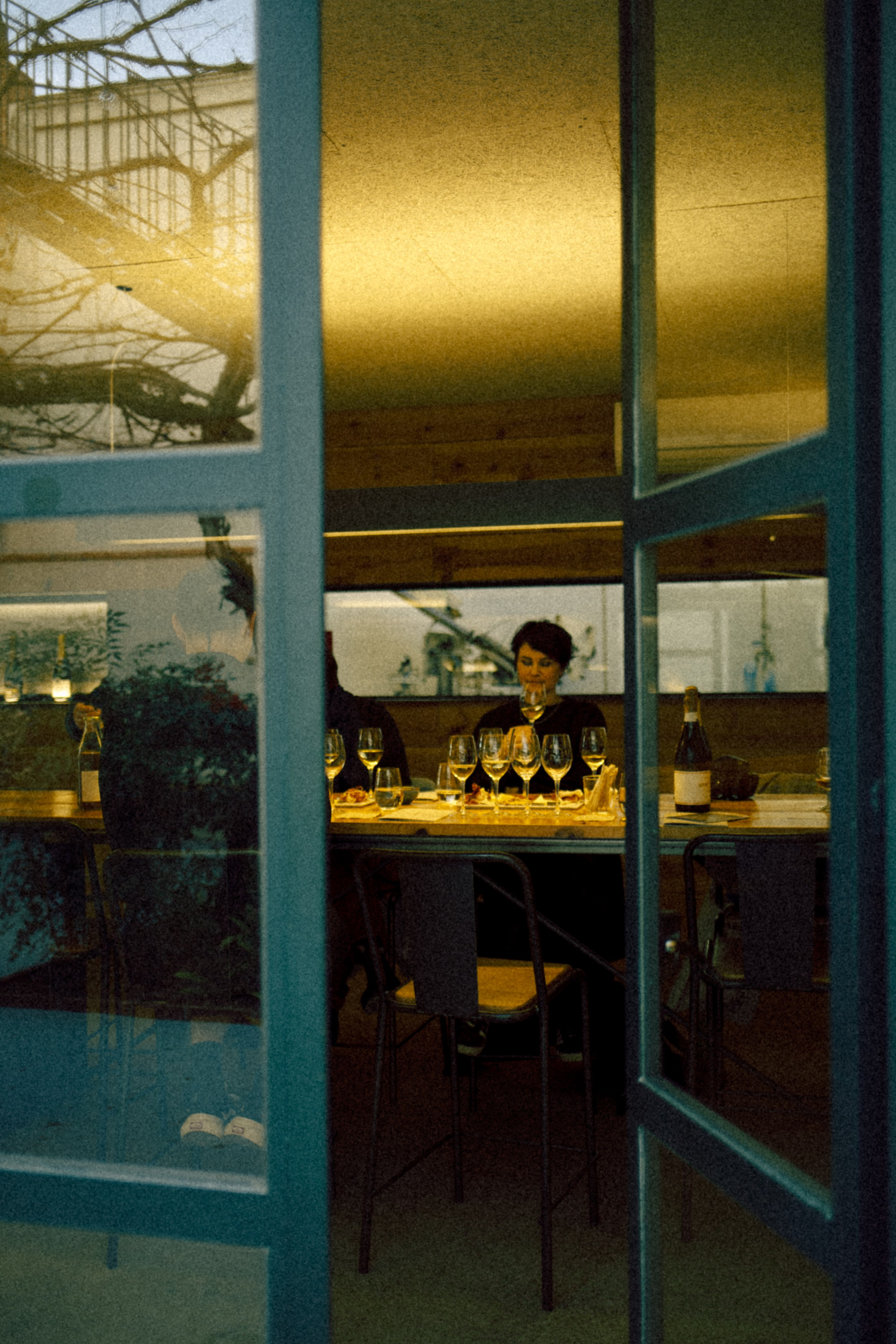 A café scene captured through reflective glass