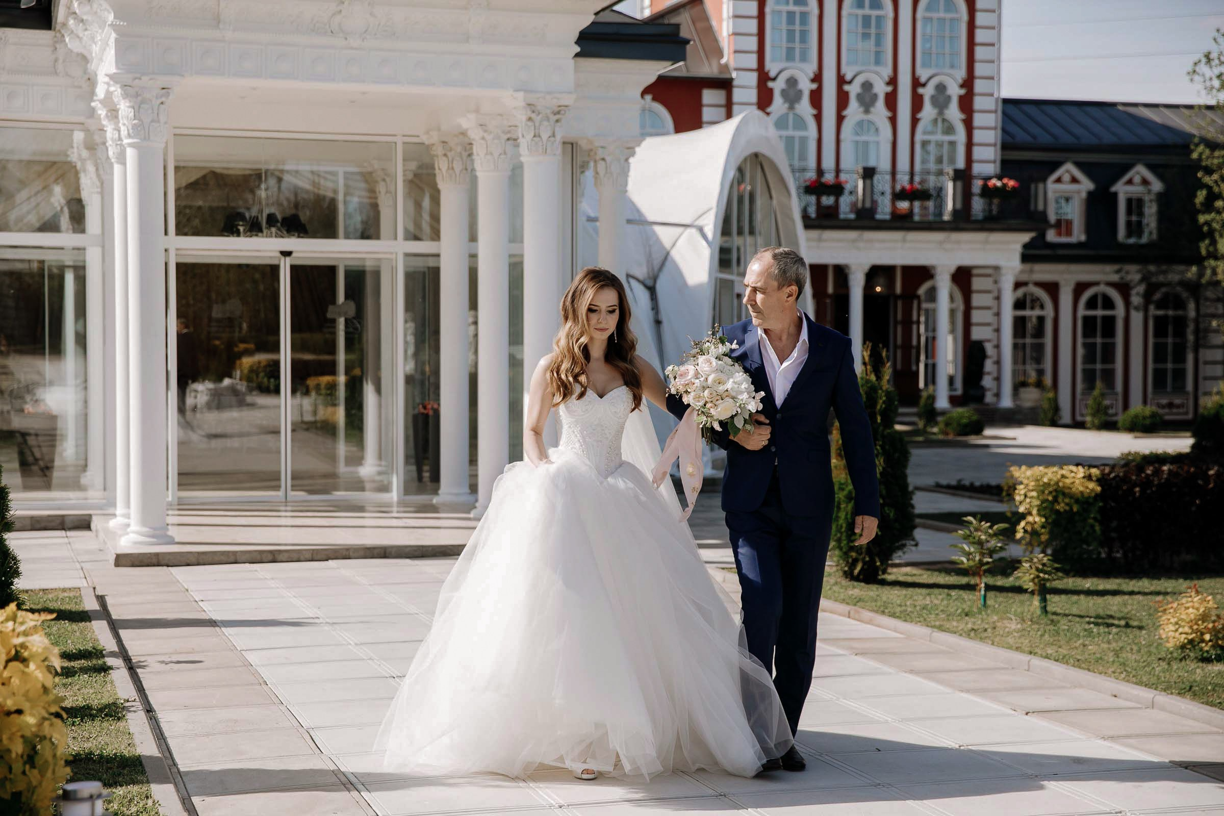 Bride walking down aisle, by Tanya Bodgan, Bude, Cornwall wedding photographer.