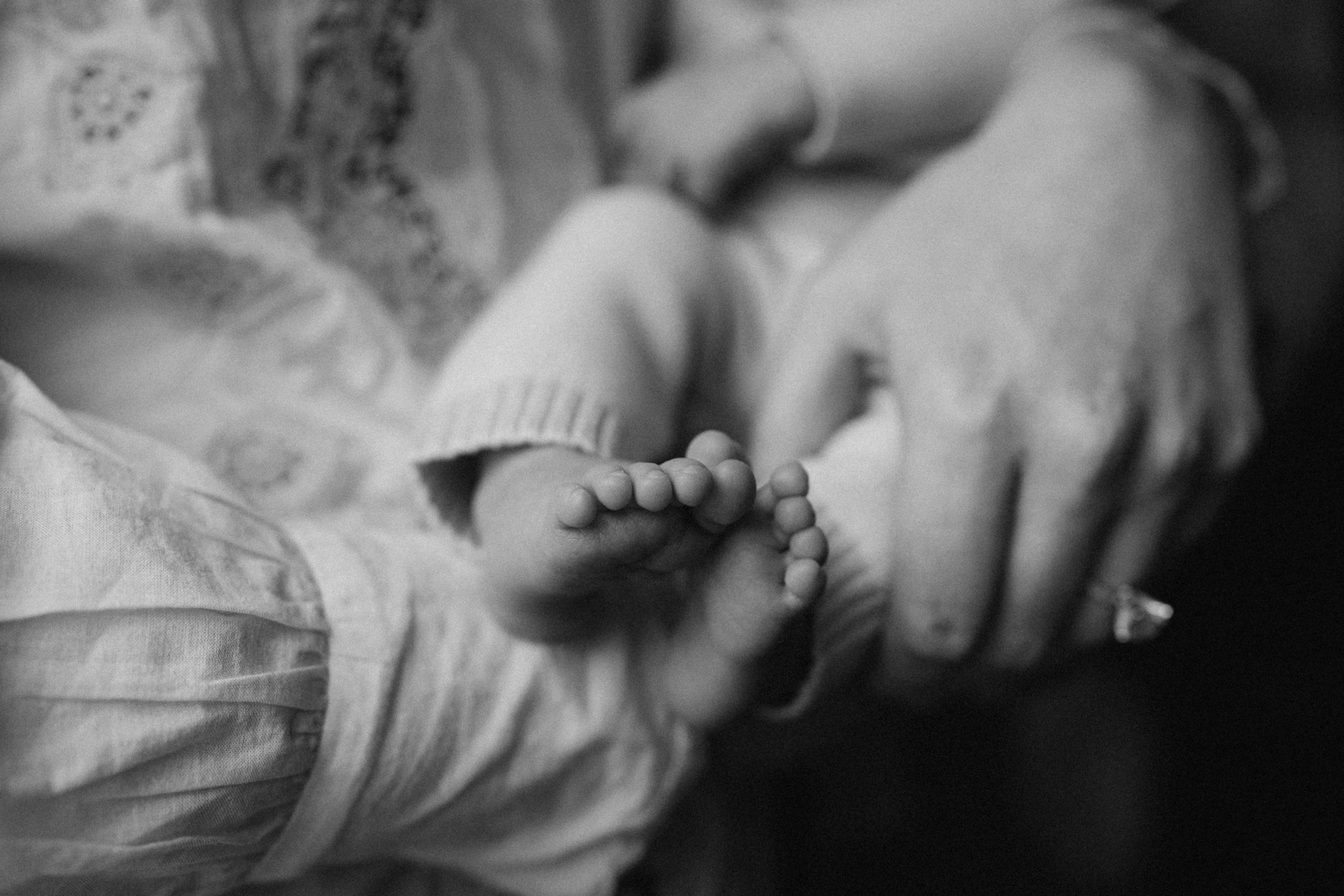 tiny feet in mum's hands