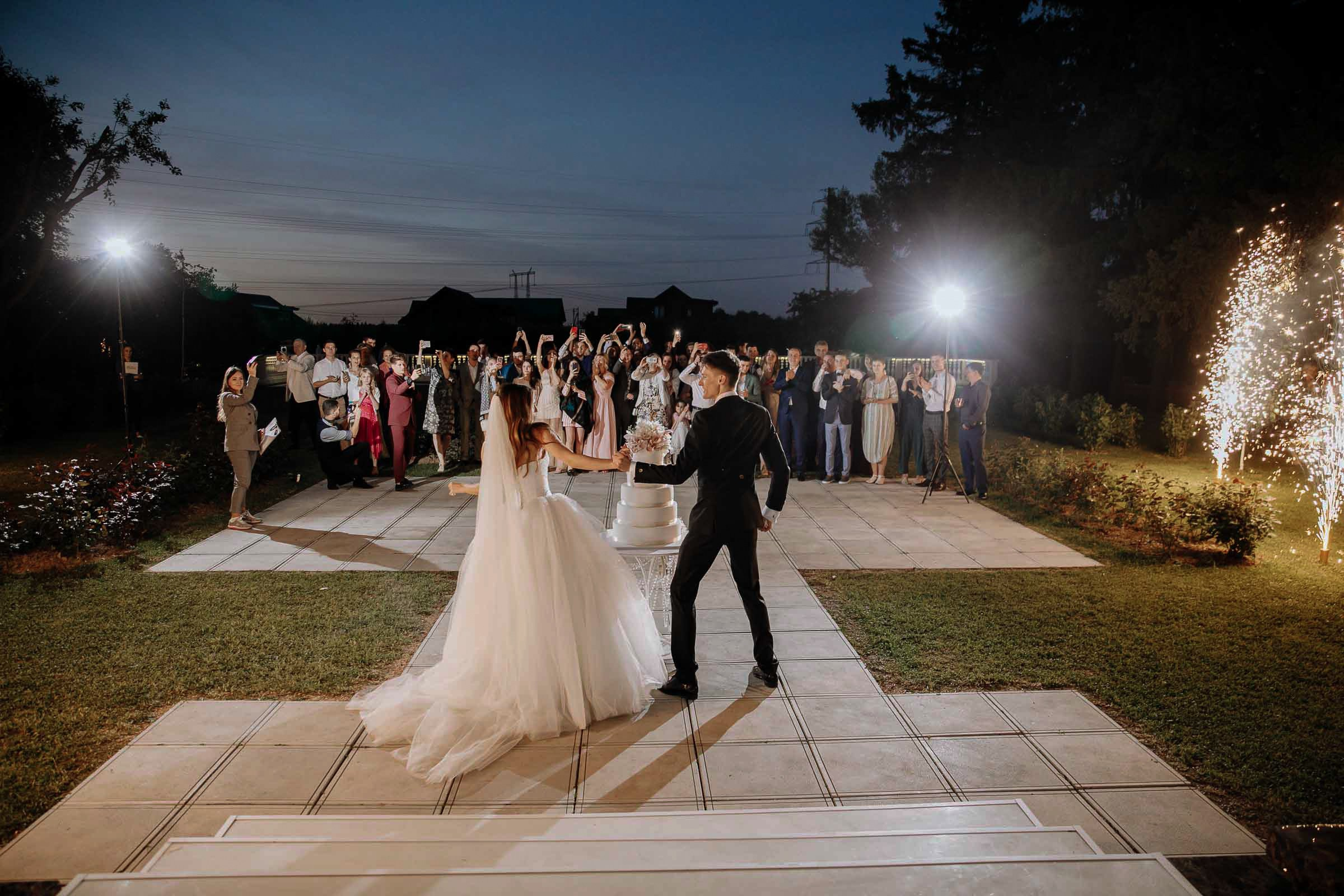 Couple’s cake cutting with fireworks, by Tanya Bodgan, Bude wedding photography.