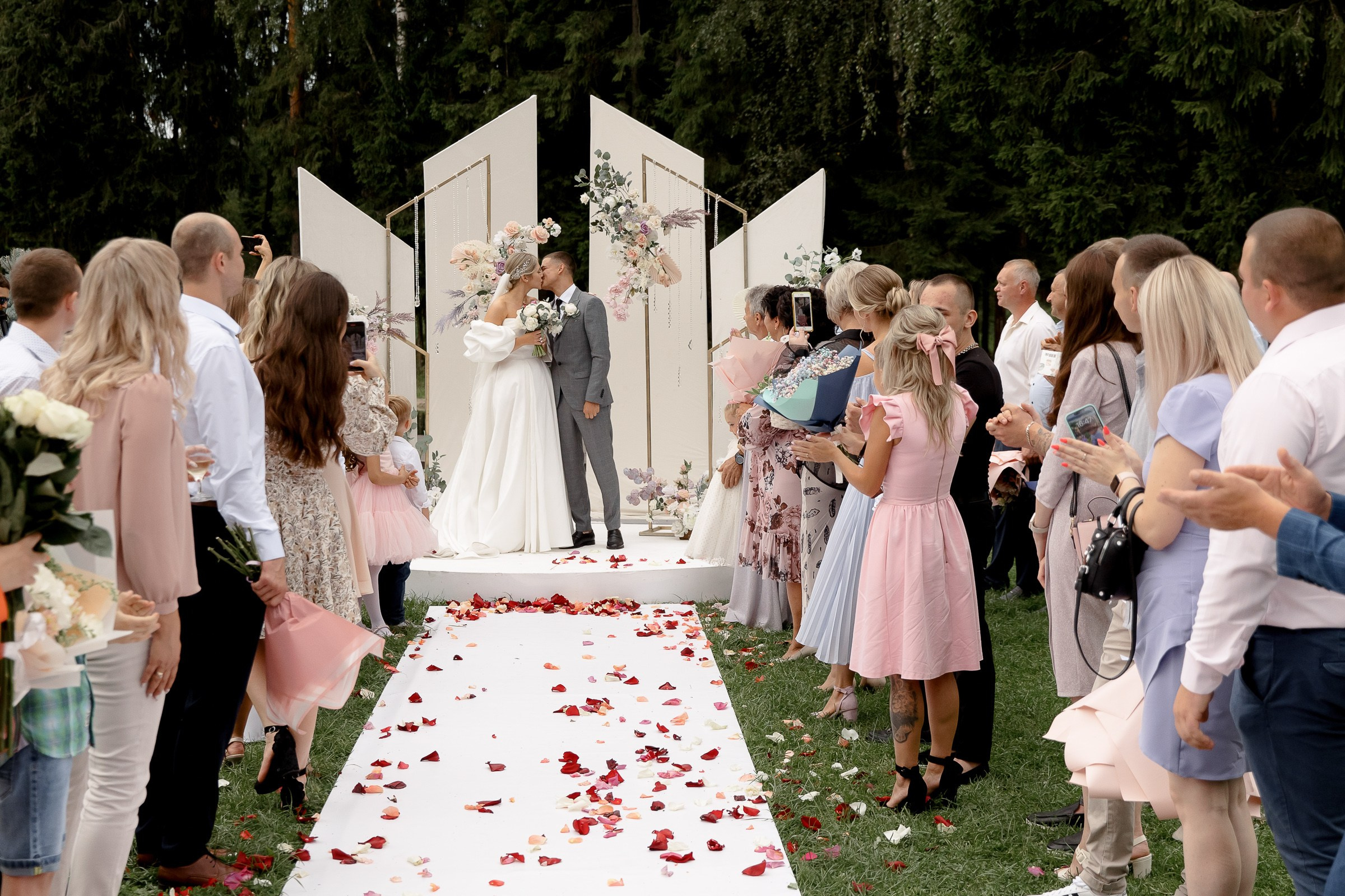 Couple exchanging vows outdoors, by Truro wedding photographer.