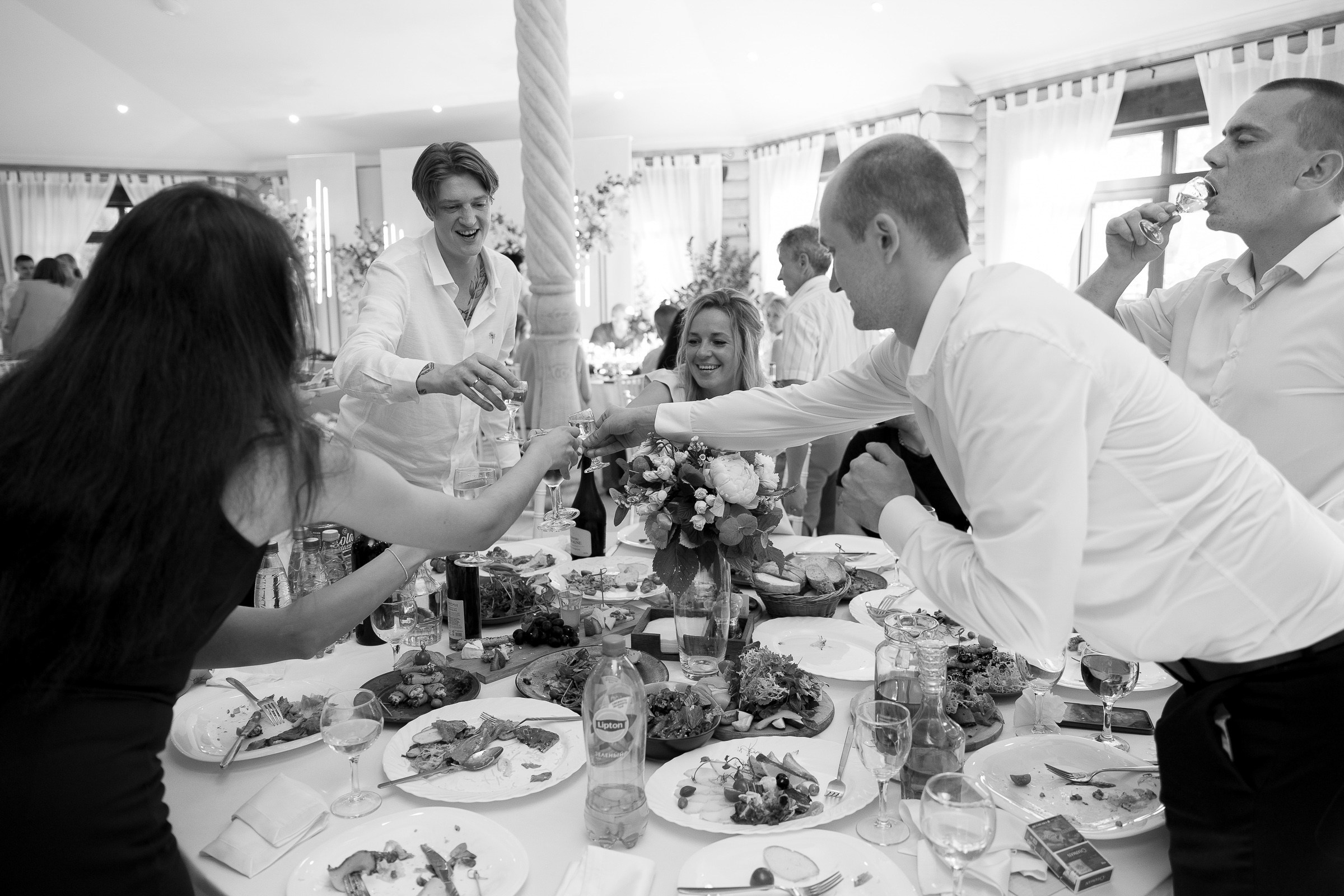 Guests toasting couple, by Exeter wedding photographer, by Tanya Bodgan.