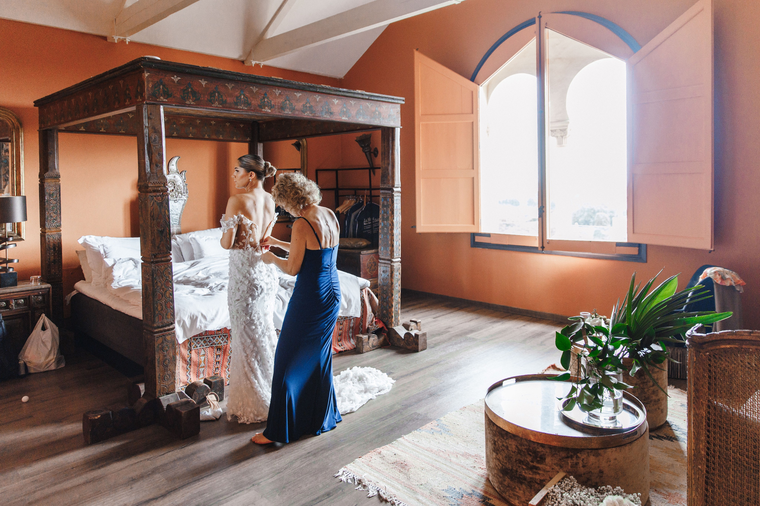 Bride getting ready for her wedding day with her mother, capturing joyful and emotional moments in Barcelona.
