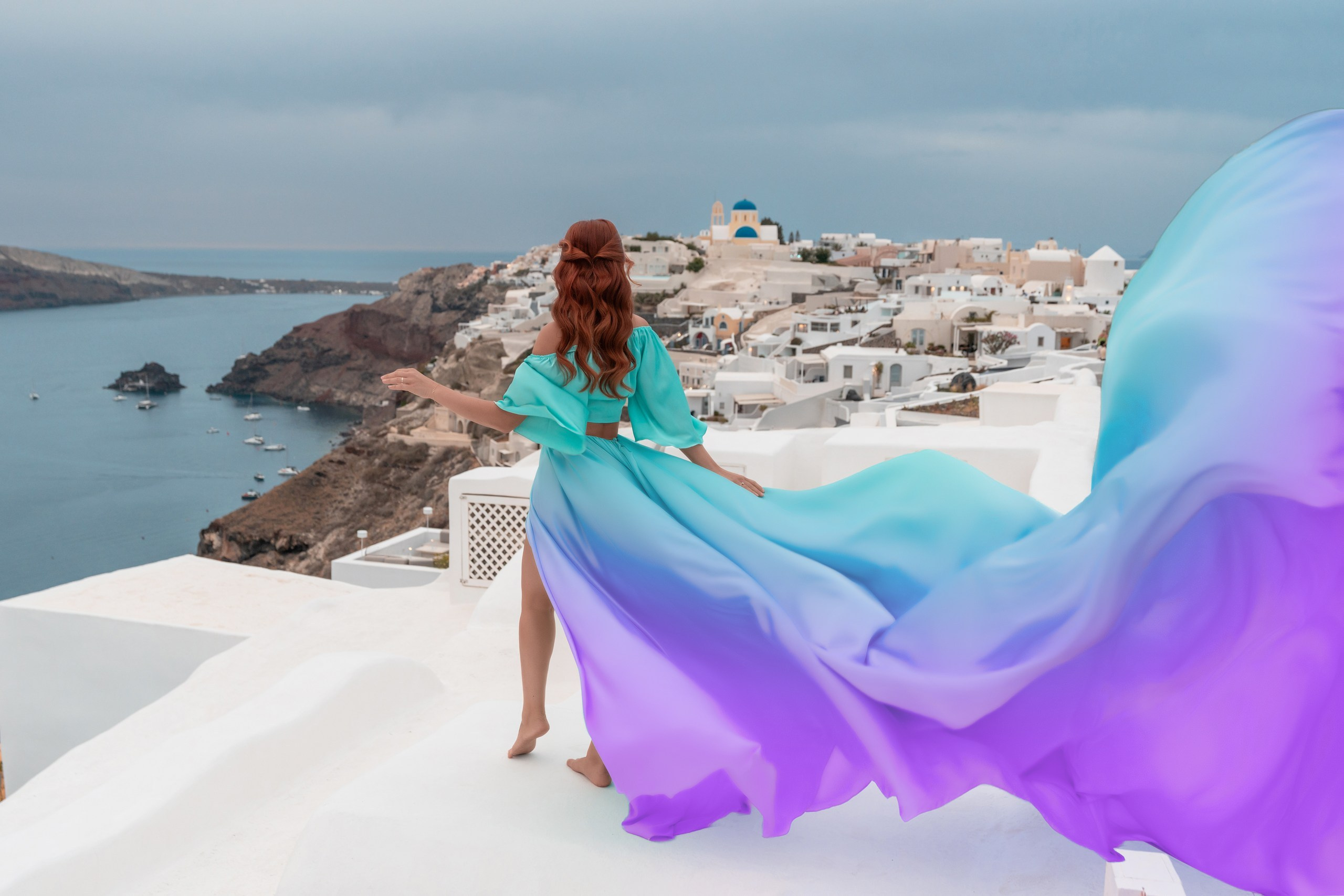Unique Photoshoot Location in Santorini: Oia Finikia. Photographer in Santorini SokoLOVE Alex| Flying Dress Santorini