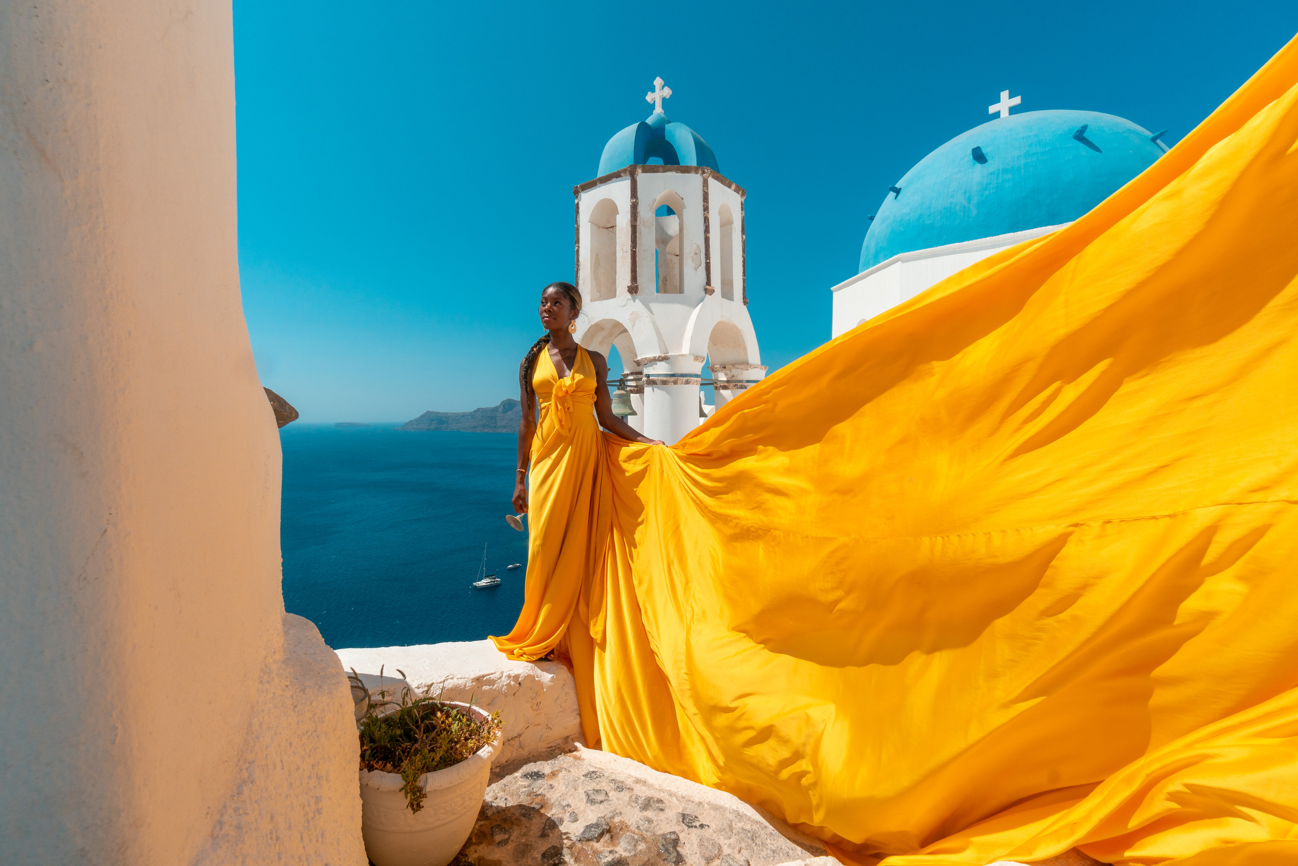 Yellow flying dress photo in Santorini