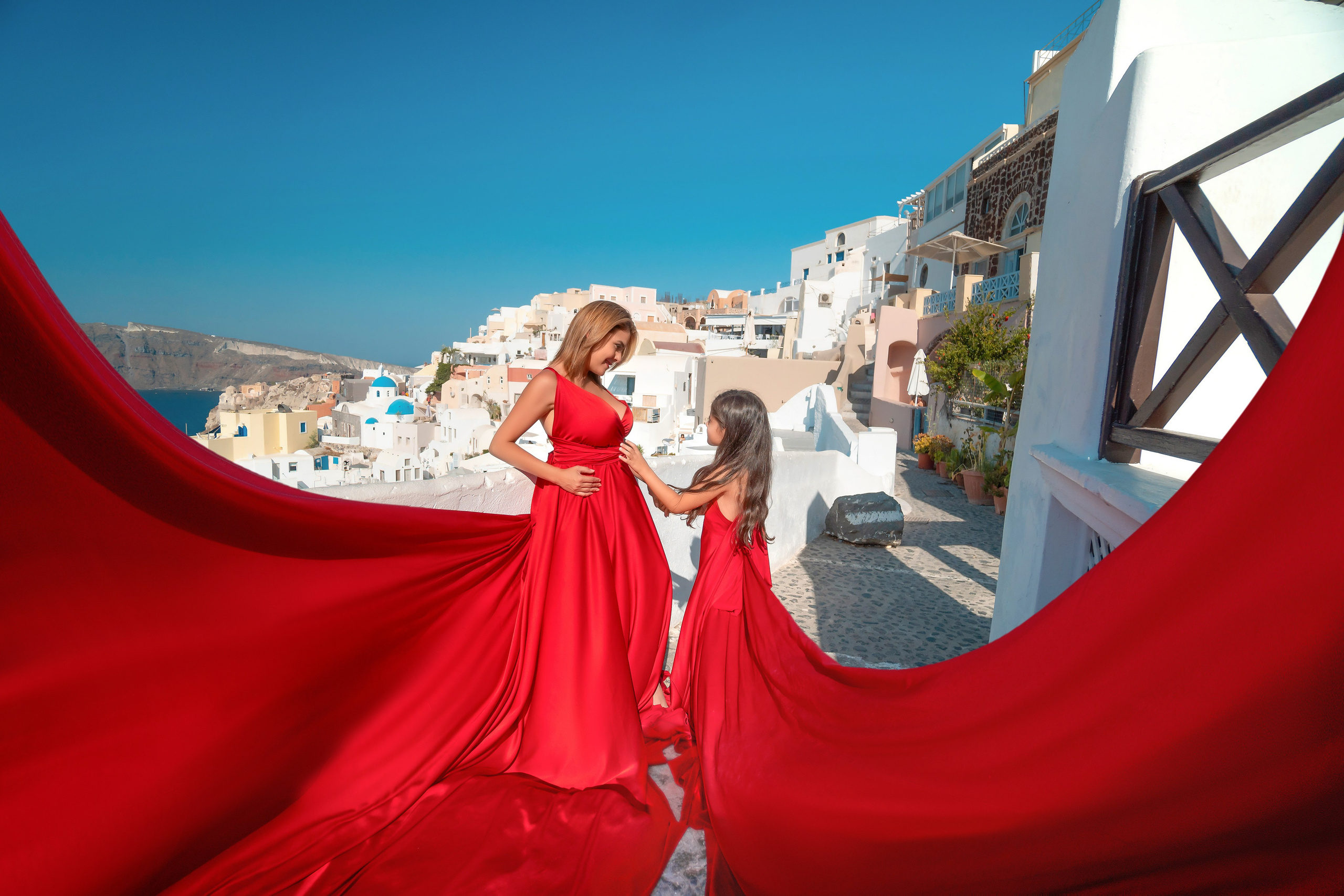 Family Photography in Oia with Flowing Dresses | Stunning Santorini Shoots. Photographer in Santorini SokoLOVE Alex| Flying Dress Santorini