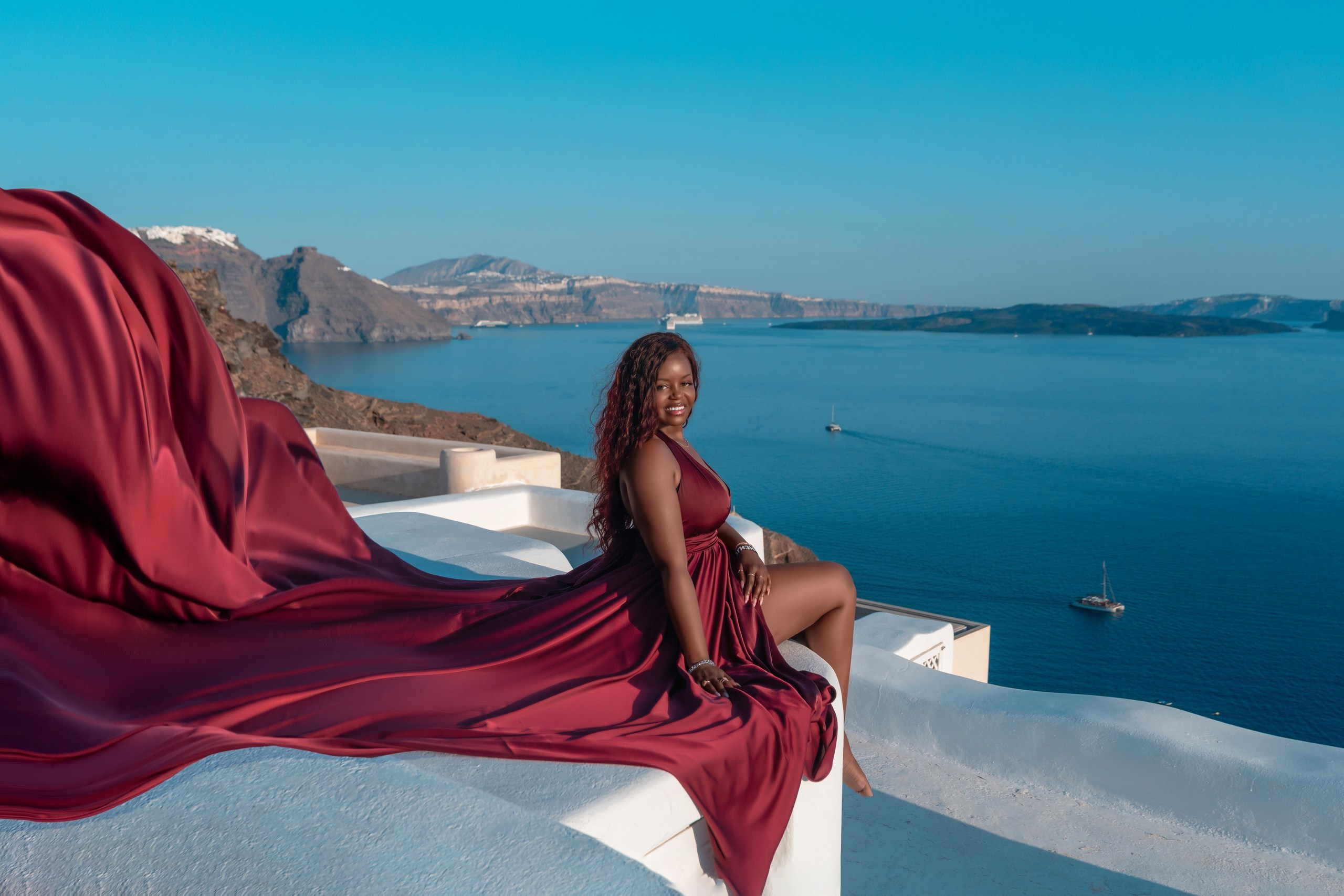 Unique Photoshoot Location in Santorini: Oia Finikia. Photographer in Santorini SokoLOVE Alex| Flying Dress Santorini