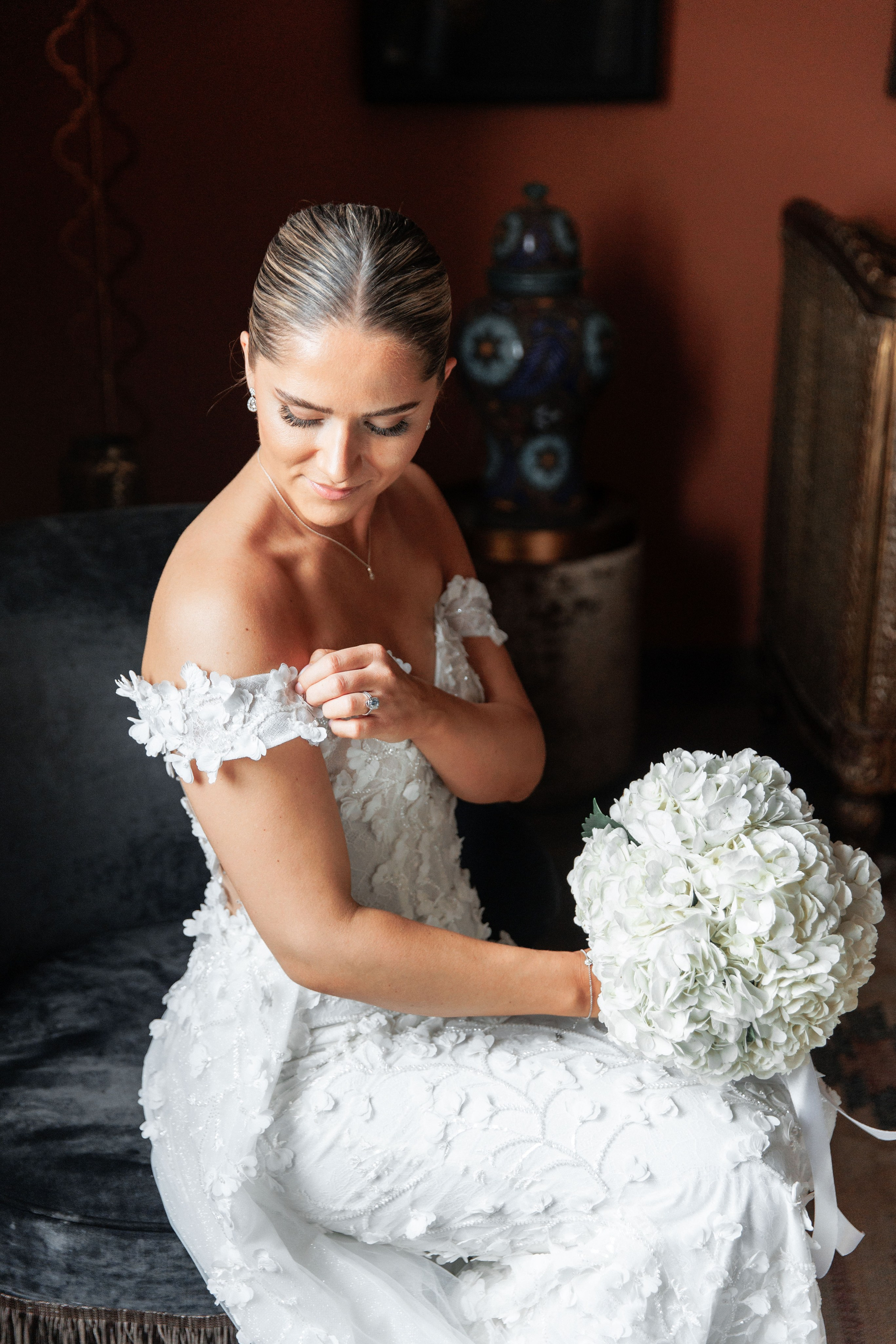 The bride is preparing in the room before going down to the wedding ceremony in Barcelona