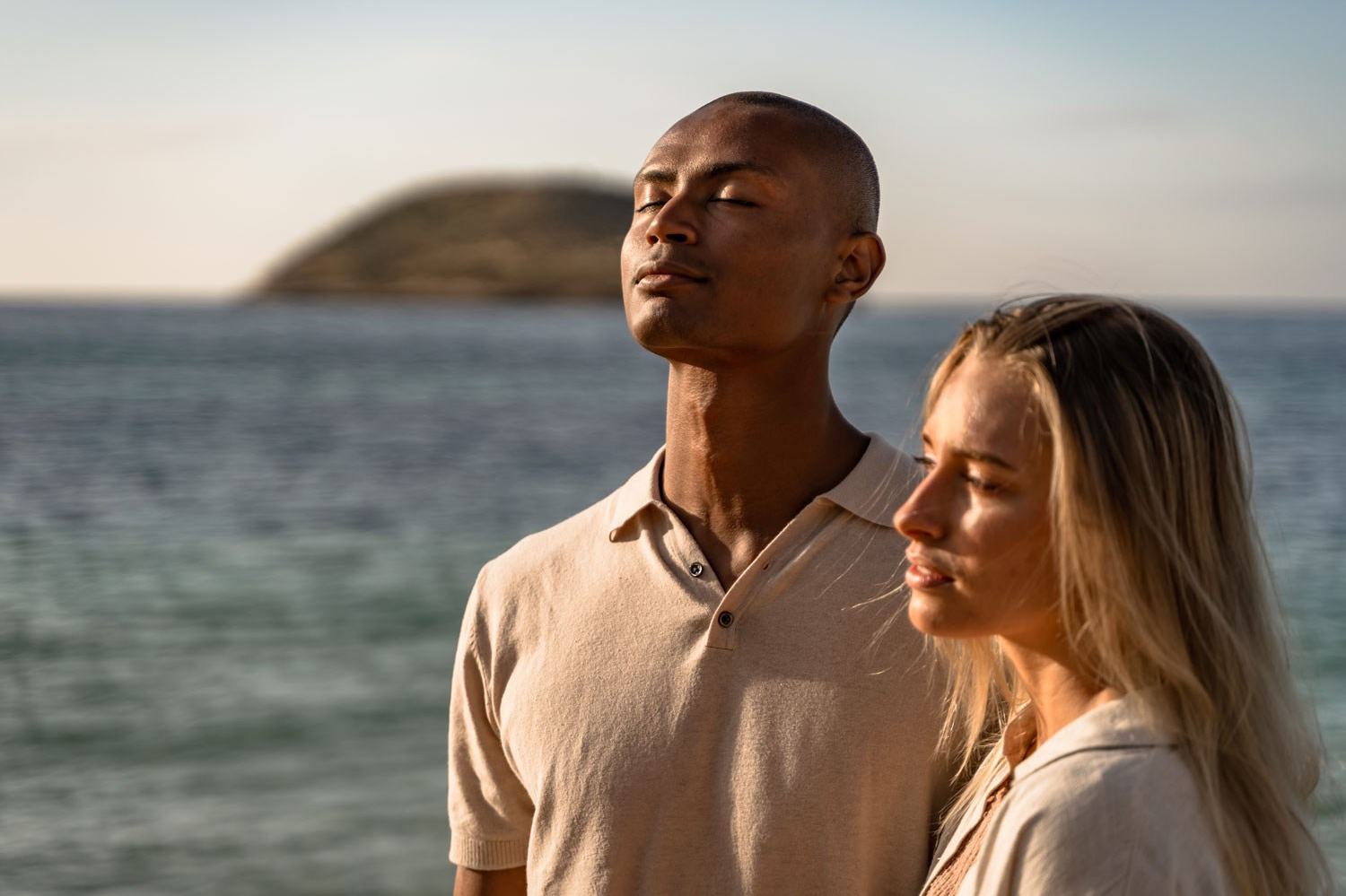 Professional fashion model posing for a skilled photographer in front of the ocean. Capturing the essence of elegance and style. Hire a top-notch photographer for stunning model portfolio shots. Book your session now for exceptional photography services.