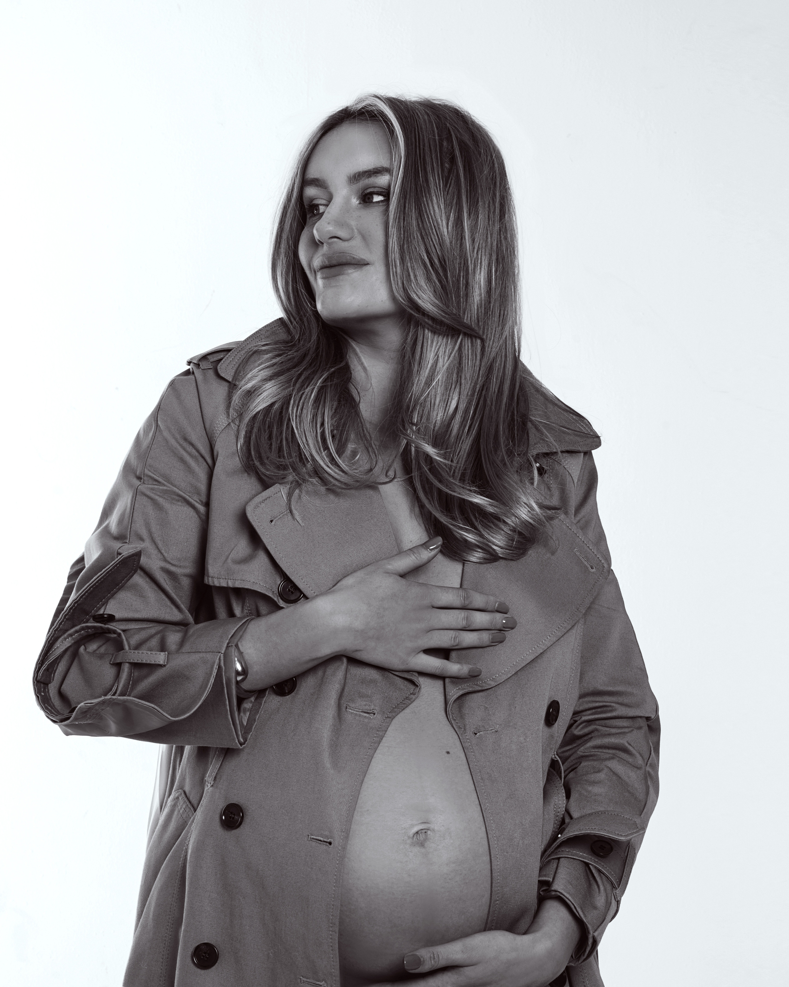 A tender and intimate pregnancy photoshoot capturing the love and bond between mother and child in a West Yorkshire studio.