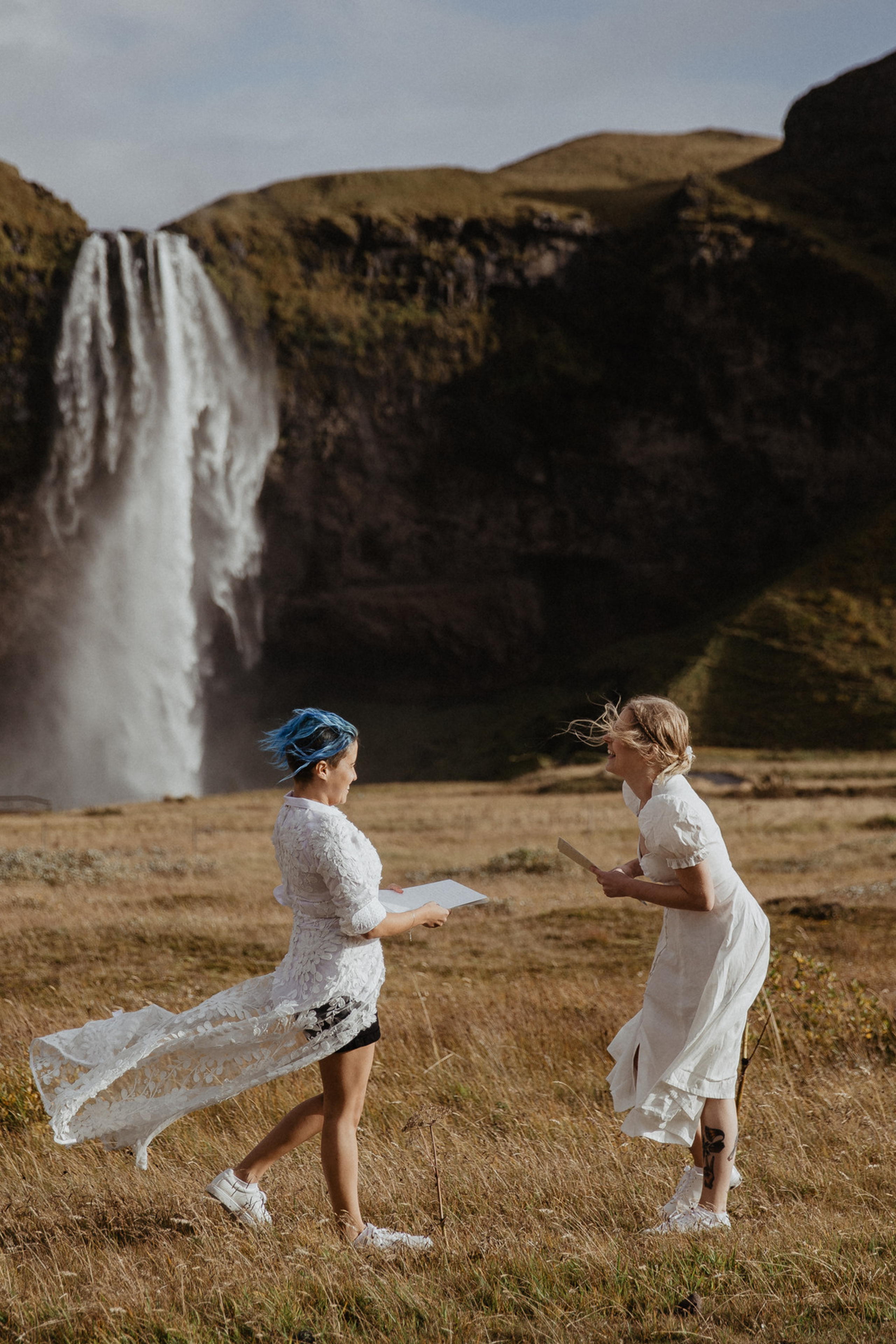 LGBT Elopement in Iceland | ceremony at Seljalandsfoss waterfall