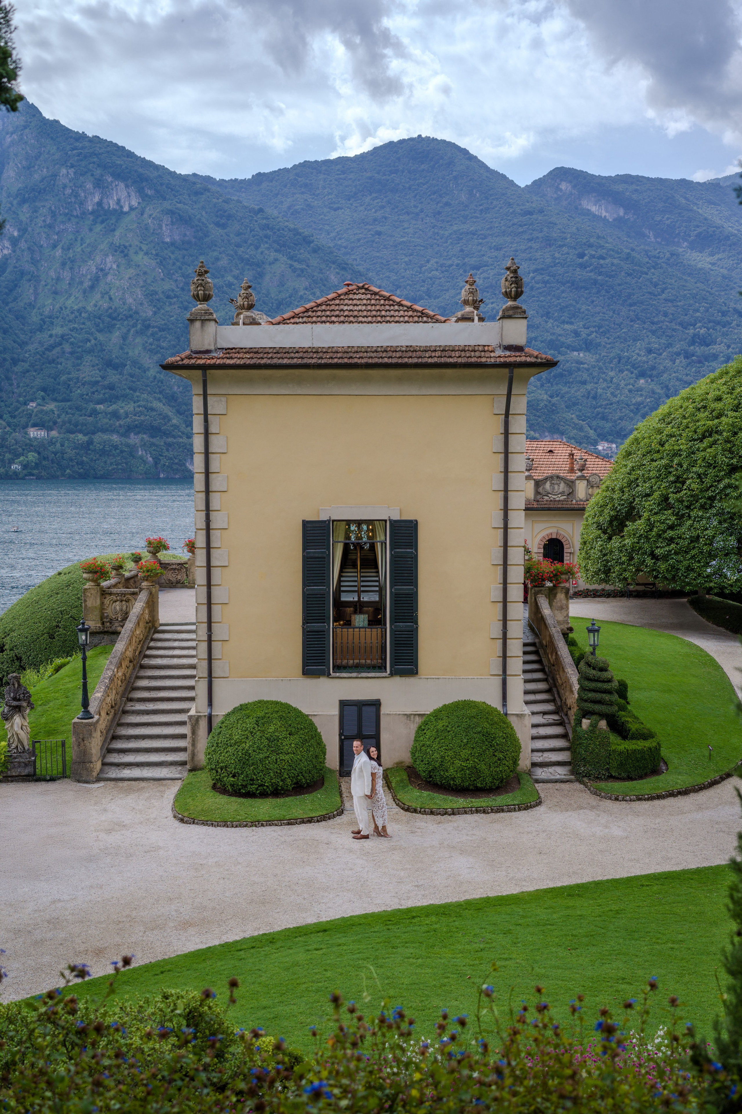 Surprise engagement moment in romantic Italian garden.