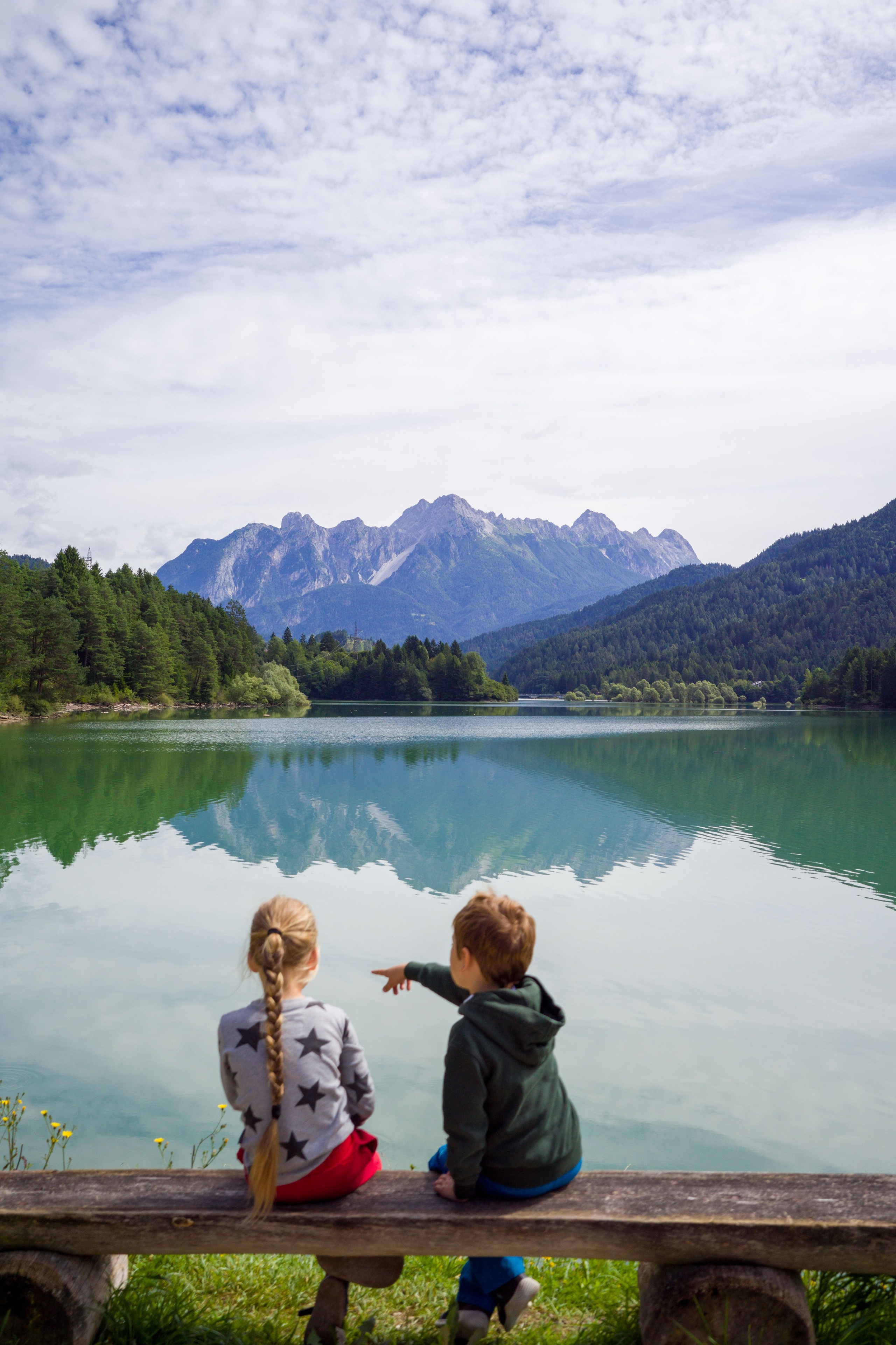 Couple embracing after a marriage proposal in the Dolomites.